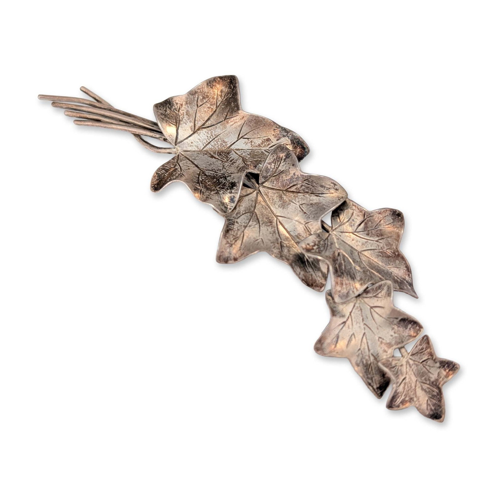 Vintage Sterling Silver Ivy Spray Brooch: Botanical brooch in sterling silver featuring five textured ivy leaves of graduated size on gathered wire stems. Stamped with logo, STERLING, and design number 2081 on the reverse. Fitted with a rolli