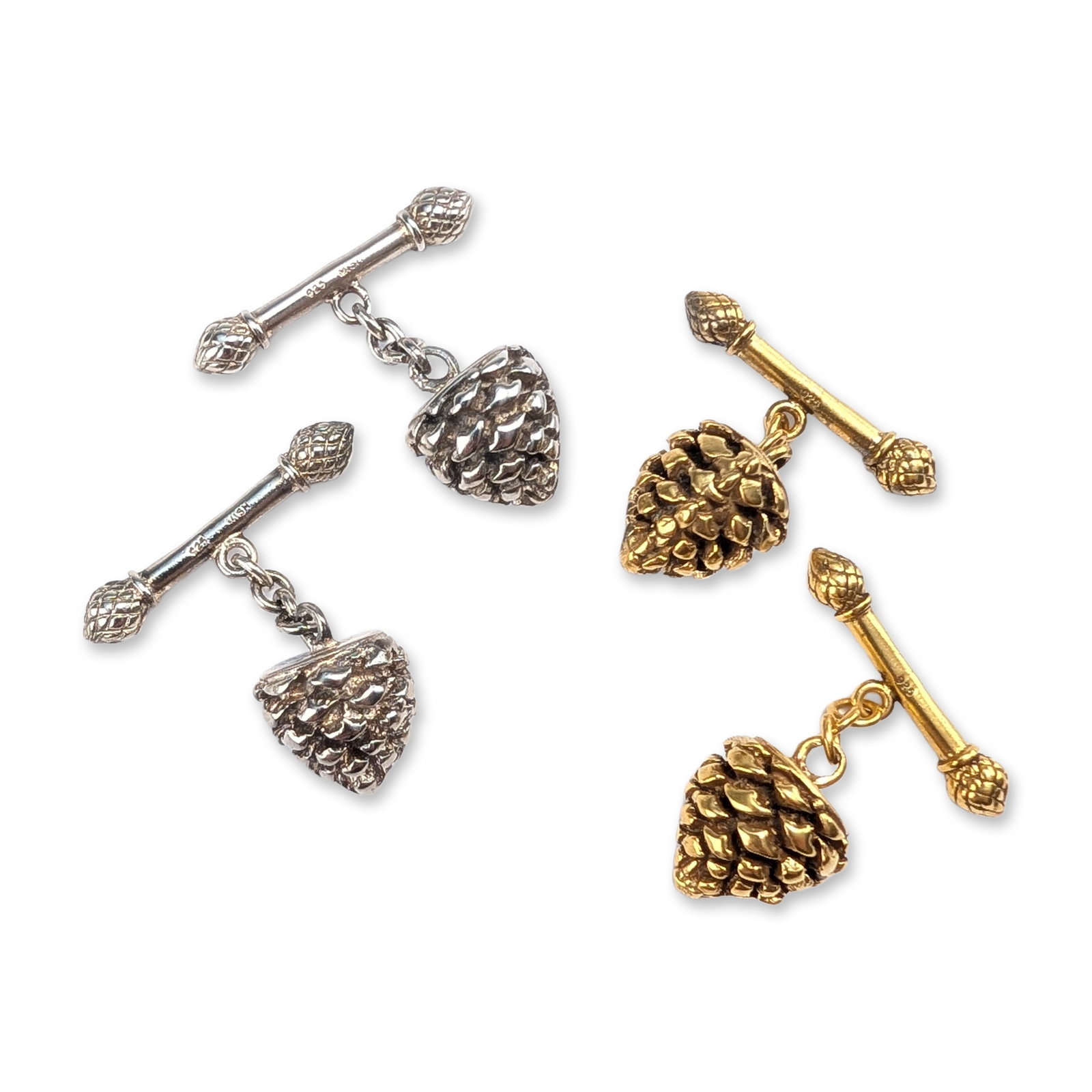 2 Pairs of Mish New York Sterling Silver Pine Cone Cufflinks: Two pairs of cufflinks in gold and silver tones, featuring pine cone motifs. Marked 925 Mish. Dimensions: 1"L Weight: 28.32 g