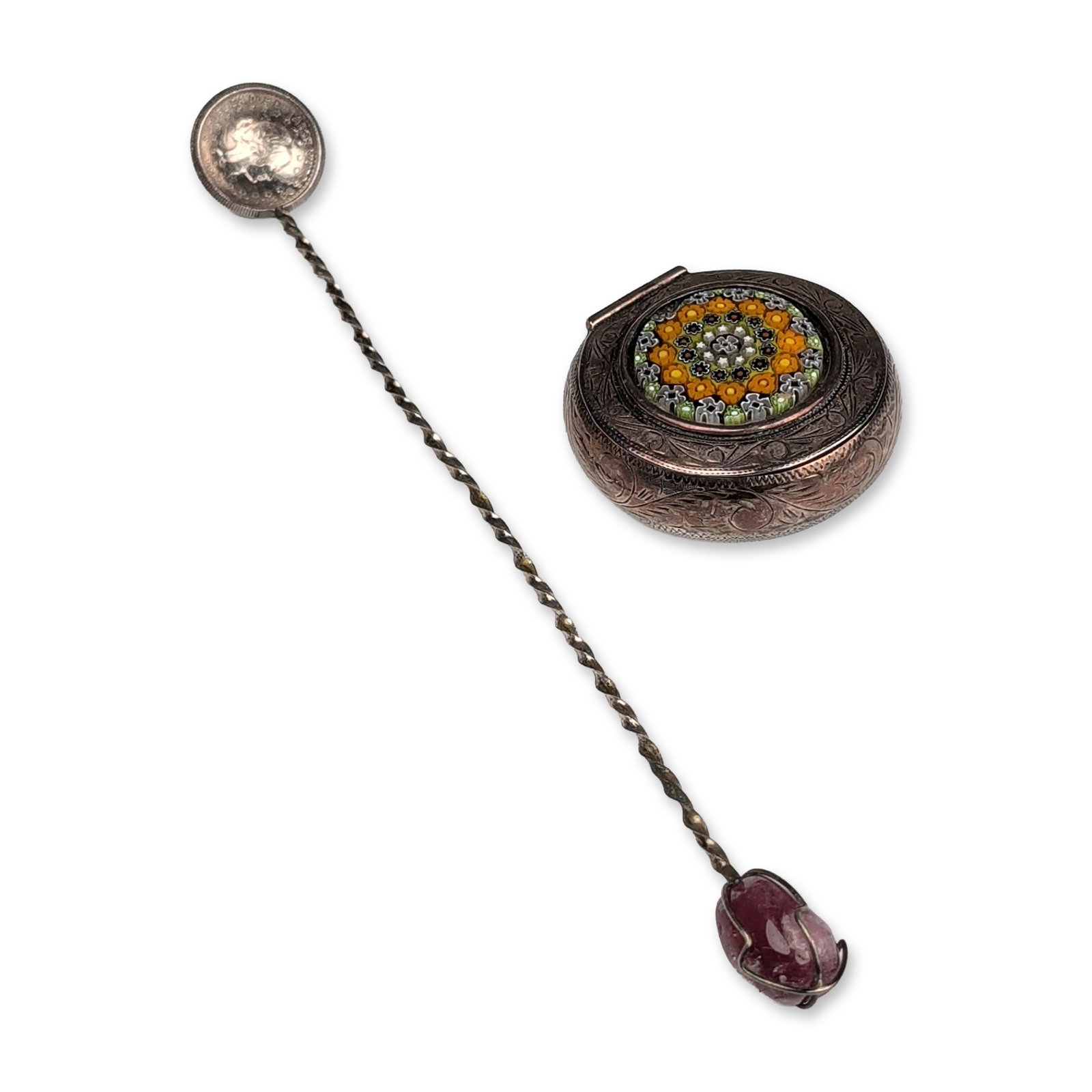 Two Silver and Gemstone Decorative Items: Two decorative items, including an engraved pill box and a Brazilian coin spoon. The oval box features a floral micro-mosaic panel on the lid with yellow, green, and white glass tesserae and hand-engr
