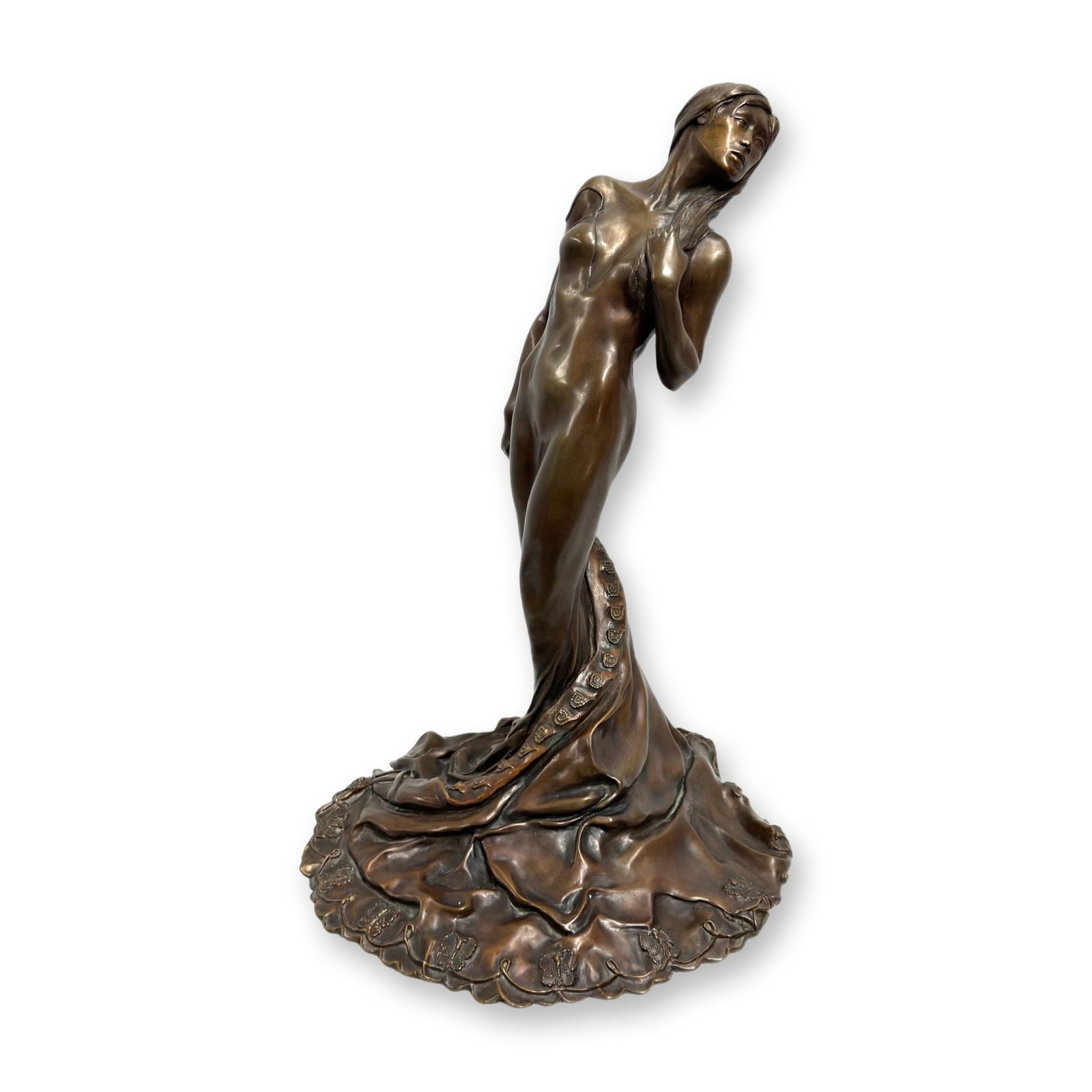 Harry McCormick Bronze Sculpture of a Draped Female Figure, 1983: This bronze sculpture by Harry McCormick depicts a stylized and elongated female figure. The figure is captured in a graceful pose with the head tilted back and a bare torso, emerging from a voluminou