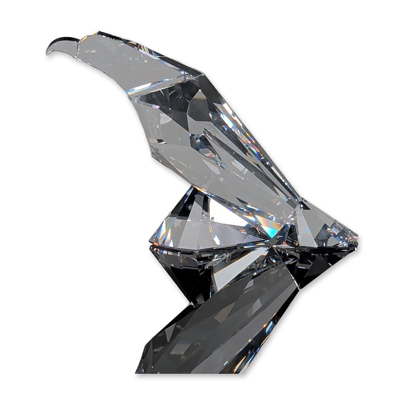 Swarovski Crystal Figurine, The Eagle: This figurine designed by Edith Mair as part of the Symbols series. The Eagle figurine is faceted clear lead crystal contemporary design. The underside of the tail bears an acid-etched Swarovski swan 