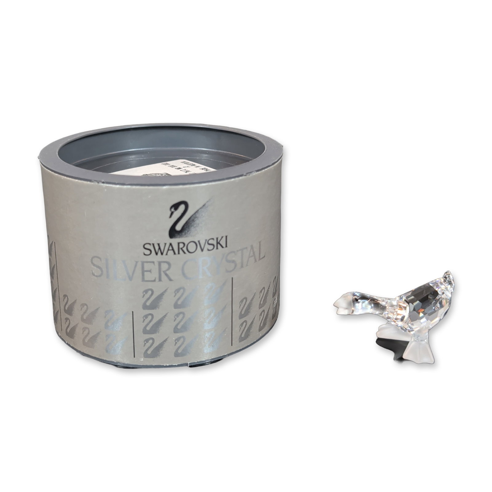 Swarovski Silver Crystal Faceted Goose Figurine: Swarovski Silver Crystal goose figurine in faceted clear lead crystal, featuring jet black crystal eyes and frosted crystal accents for the beak and webbed feet. Marked with an acid-etched swan logo o