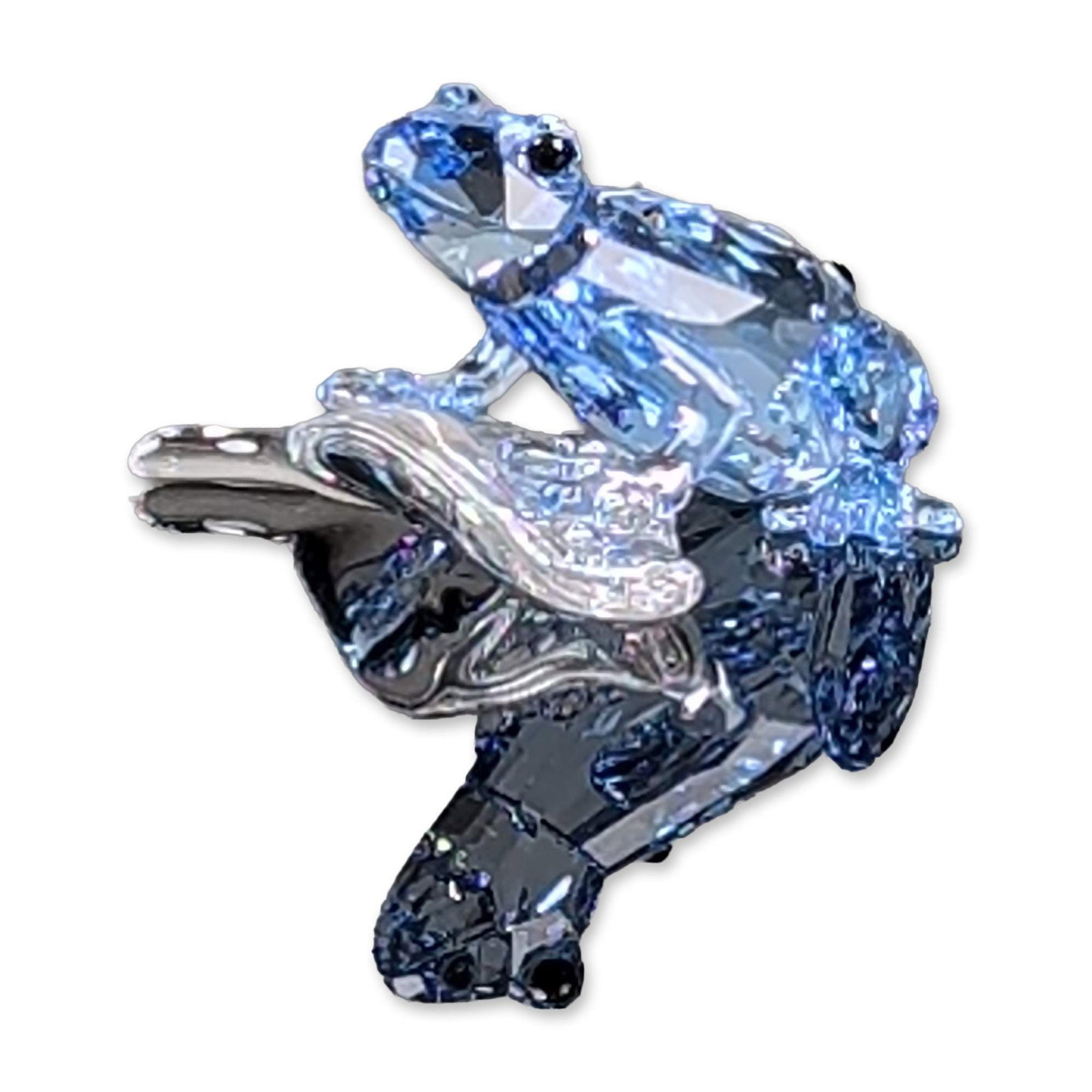 Swarovski Crystal 2009 Event Figurine, Dart Frog on Leaf: Figurine in faceted lead crystal, featuring a dart frog designed in contrasting light aquamarine and dark sapphire blue crystal perched on a clear crystal leaf base. The frog are detailed with black b