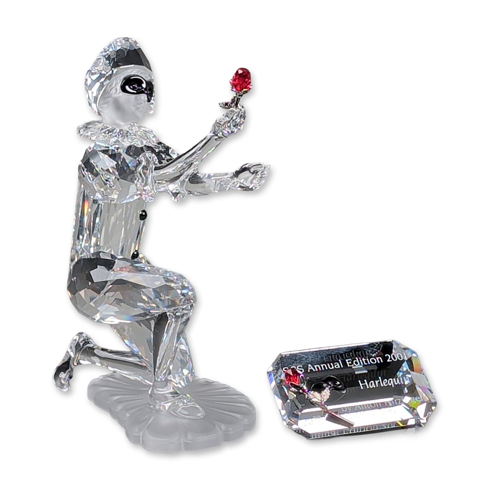 2pc Swarovski SCS 2001 Annual Edition Crystal Figurine, Harlequin with Title Plaque: Swarovski SCS Annual Edition 2001, Harlequin, from the Masquerade trilogy. A faceted lead crystal figurine designed by Anton Hirzinger, featuring a dynamic pose with a frosted crystal ruff and skirt. 