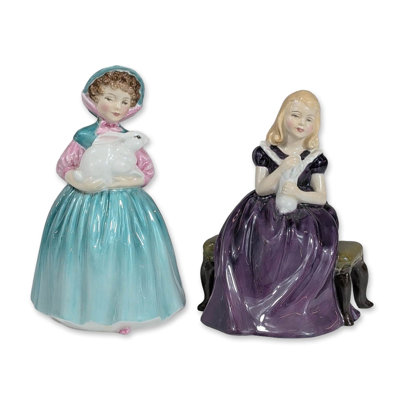2pc Royal Doulton Porcelain Figurines Affection HN 2236 and Bunny HN 2214: Royal Doulton (English, mid-20th century). Two polychrome glazed bone china figurines titled Affection and Bunny. Affection (HN 2236) depicts a seated young girl with blonde hair in a deep purple dres