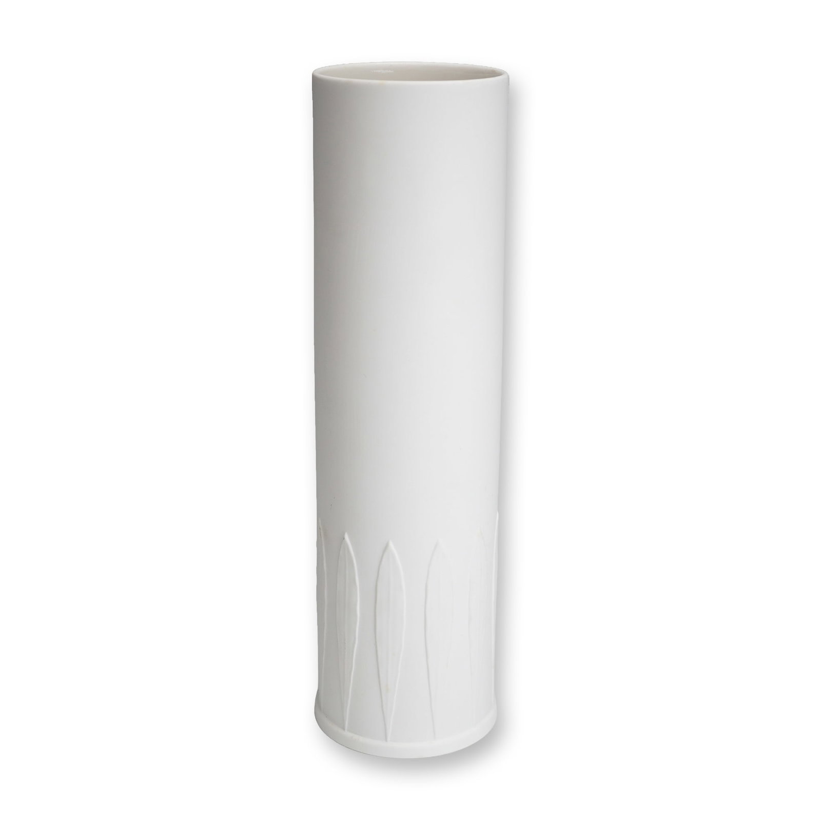 Kelly Hoppen for Wedgwood Bone China Cylinder Vase: This white bone china vase was designed by Kelly Hoppen for Wedgwood. It features a tall, slender cylindrical form with a matte exterior finish. The lower section of the body is decorated with a molde