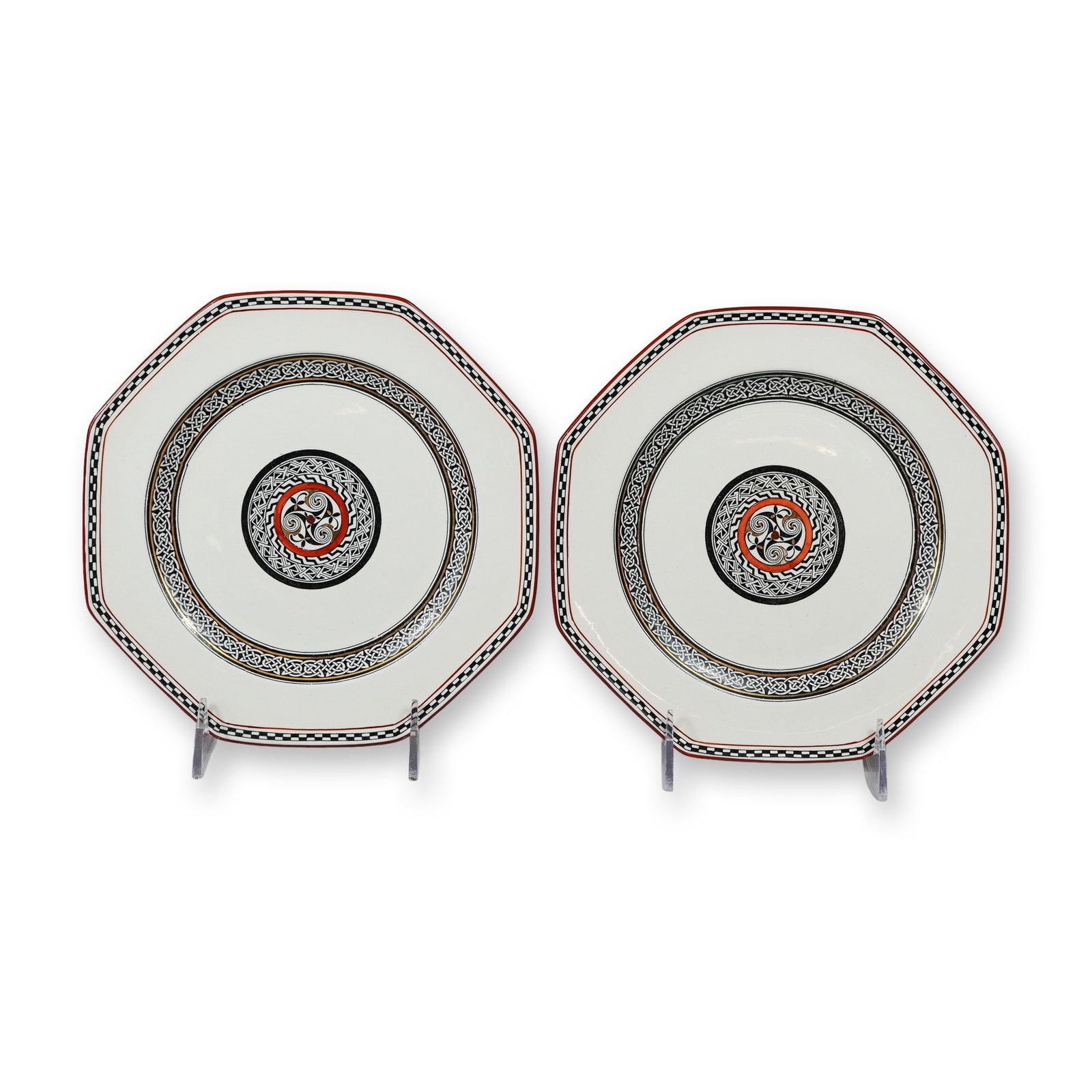 A Pair of Wedgwood Etruria Octagonal Celtic Revival Plates: This pair of octagonal ceramic plates was manufactured by Wedgwood at the Etruria factory in England. The pieces are crafted from fine earthenware creamware. The decoration is executed in a Celtic Rev