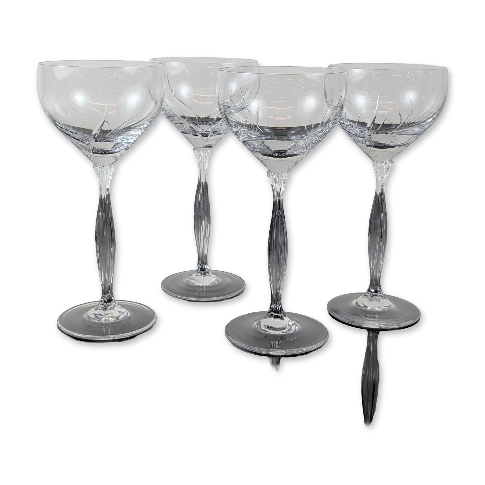 Set of Four Spiegelau Vesta Crystal Water Goblet: A set of four cut lead crystal glasses, featuring spiral cuts on the bowl and a twisted stem that flows seamlessly from the base of the bowl. The subtle vertical twist ends in polished, circular feet.