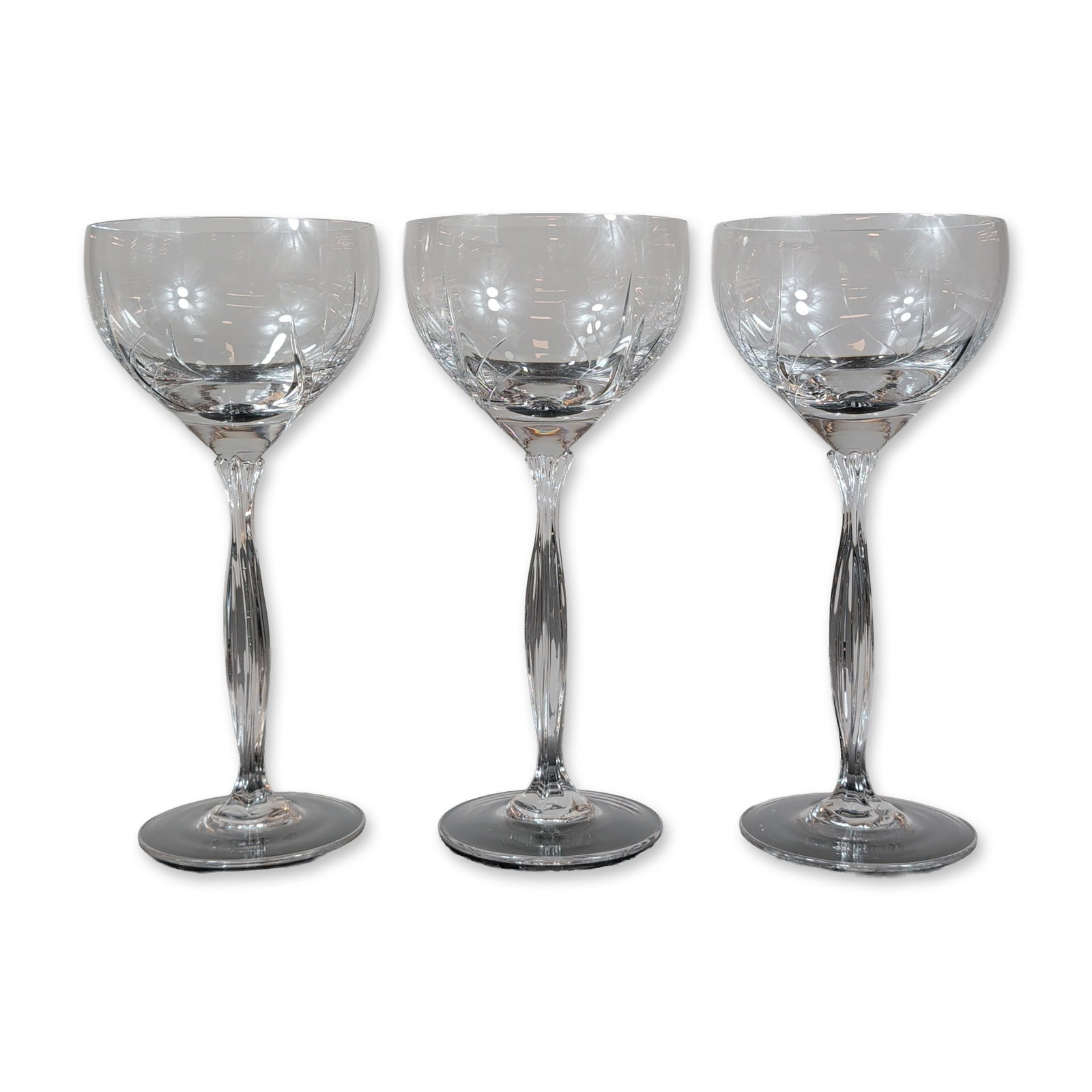 Trio of Spiegelau Vesta Crystal Water Goblets: Glasses in the Vesta pattern, crafted from cut crystal. Each vessel features a rounded bowl decorated with deep miter cuts that fan upward from the base, positioned above a faceted stem with vertical 