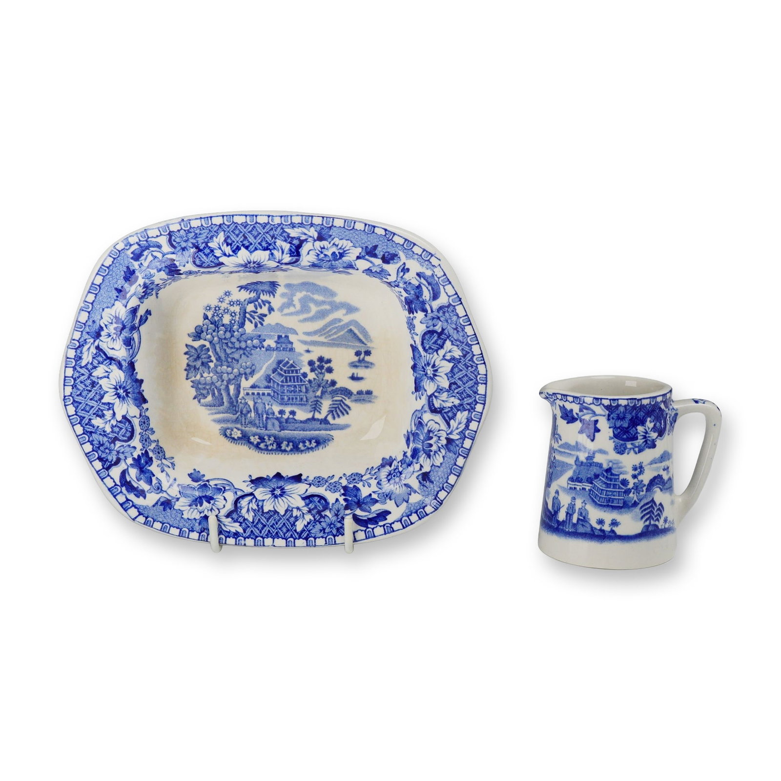 2pc Wood and Sons Seaforth Pattern Blue and White Transferware Pieces: This lot features two pieces of blue and white transfer-printed earthenware produced by Wood and Sons of Burslem, England, in the Seaforth pattern. The set comprises one small tapered pitcher with a s