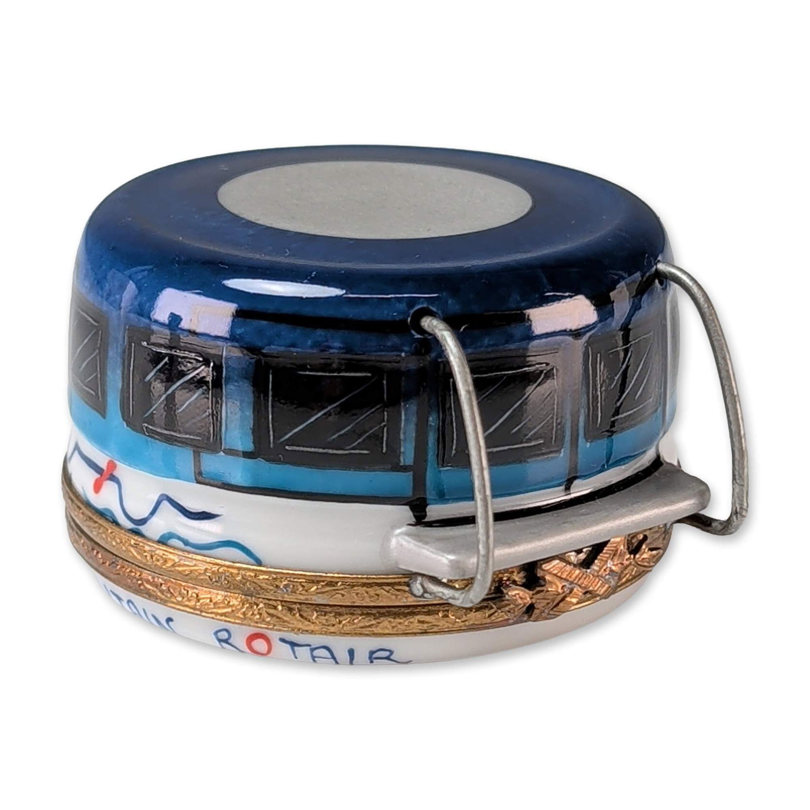 Limoges Hand Painted Porcelain Rotair Trinket Box: Limoges, France, hand-painted porcelain trinket box modeled as a Table Mountain Rotair cable car gondola, featuring a blue and white glazed body with black-outlined windows and two silver-tone wire ca