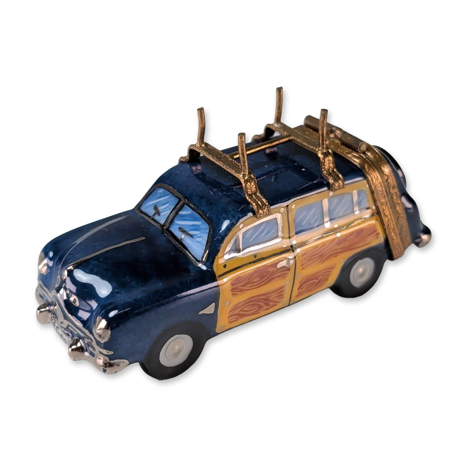 Limoges Porcelain Woodie Station Wagon Box: French Limoges hand-painted porcelain trinket box modeled as a blue station wagon with simulated wood-grain side panels. The piece features a hinged metal frame with a roof rack holding two gold-toned