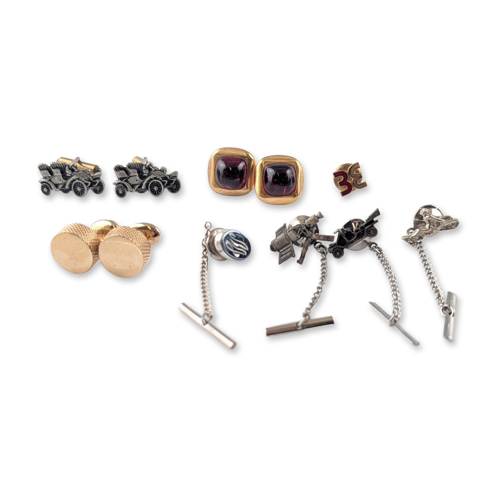 Swank and Vintage Gold-Tone Cufflinks and Tie Pin Collection: Swank and vintage men's jewelry accessories. Collection of 3 pair of cufflinks and 5 tie tacks in gold-tone and silver-tone base metals, featuring an assortment of novelty and classic motifs. Included