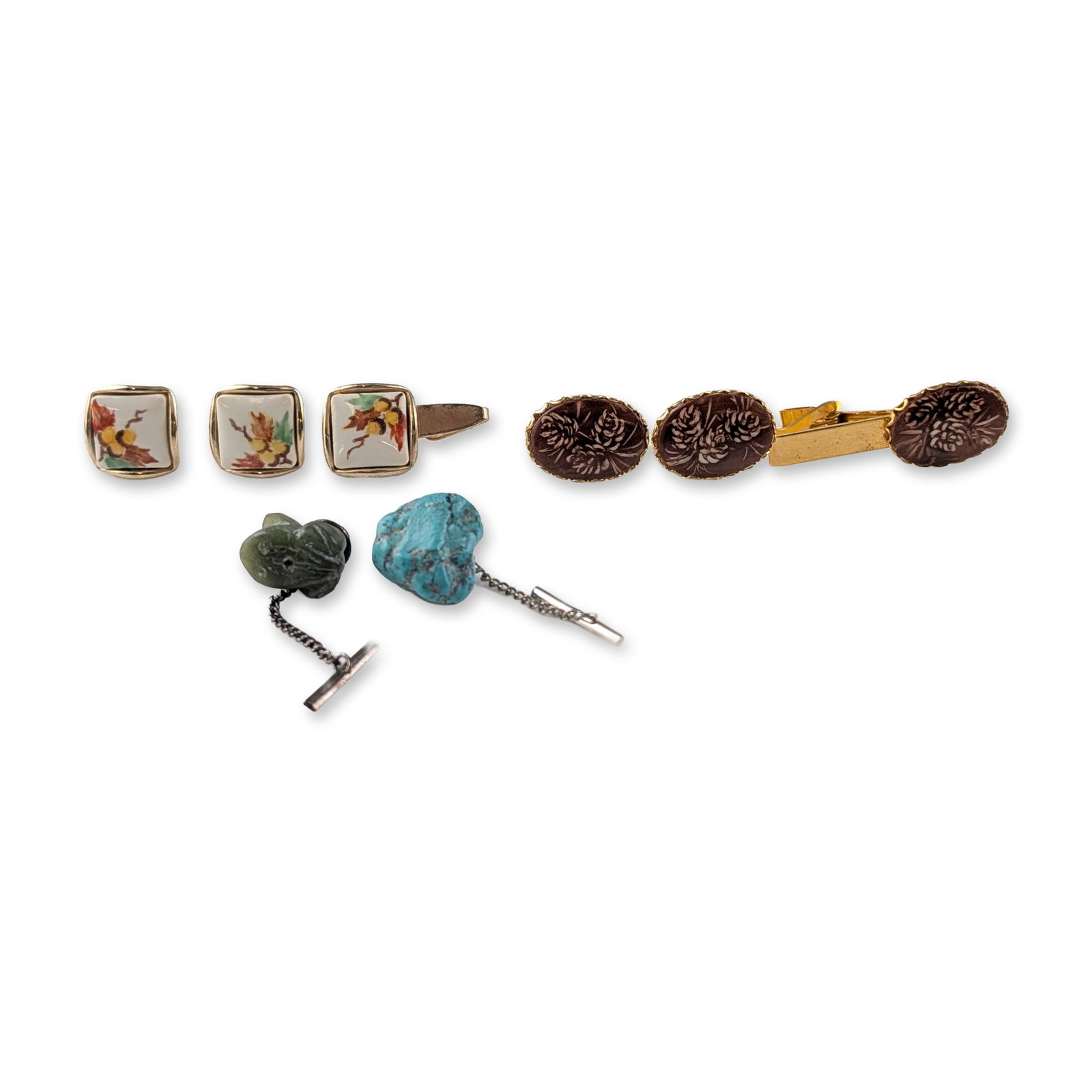 8pc Collection of Vintage Men's Accessories - Cufflinks, Tie Pins and Tie Clips: Group of vintage men's jewelry accessories in yellow-tone metal. The collection features square cufflinks with white ceramic or enamel inserts decorated with a multi-colored leaf and berry motif. A ma