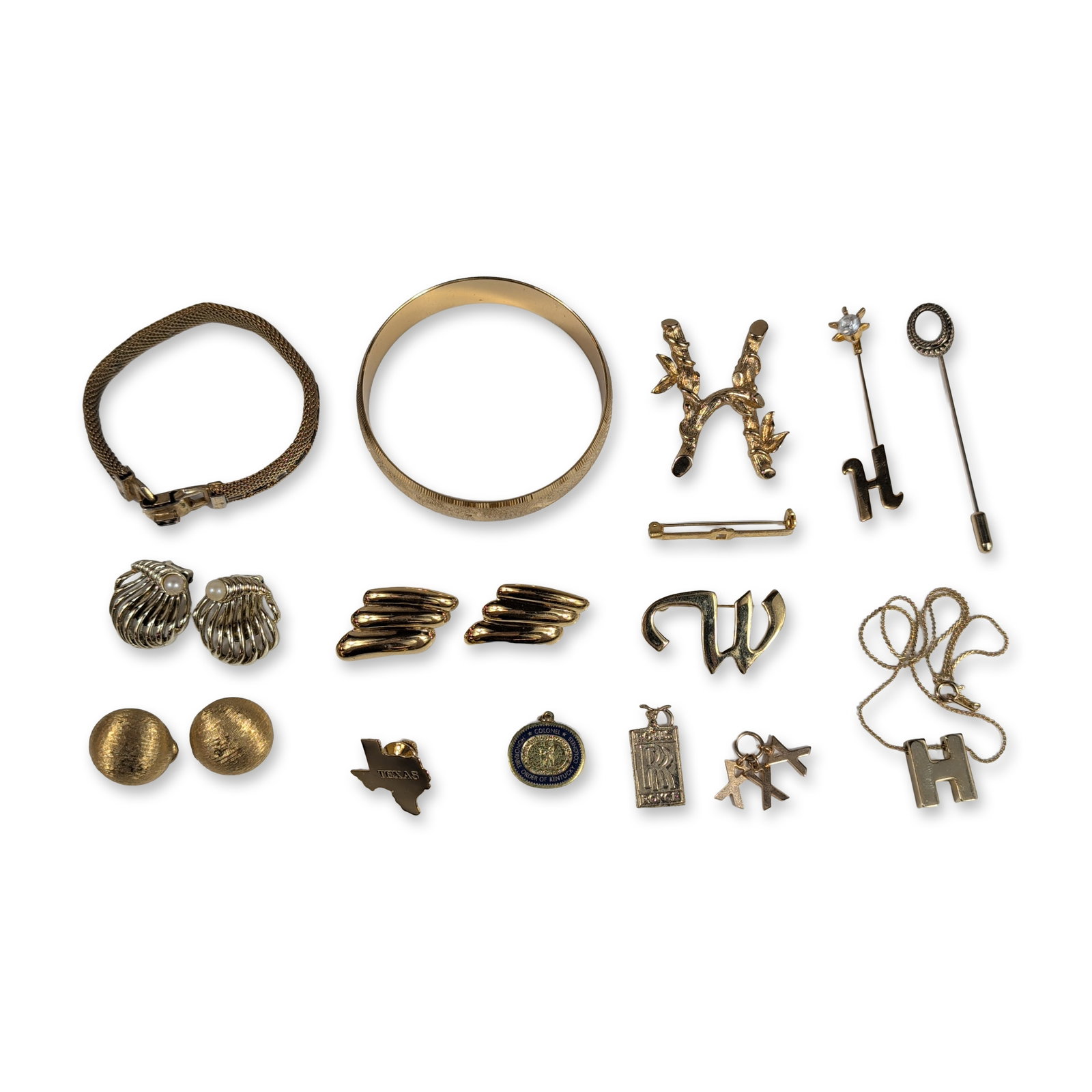 18pc Collection of Gold-Tone Costume Jewelry: An assortment of gold-tone costume jewelry and accessories including bracelets, brooches, earrings, and pendants. The group features a mesh bracelet with a buckle clasp, a textured bangle, and three b