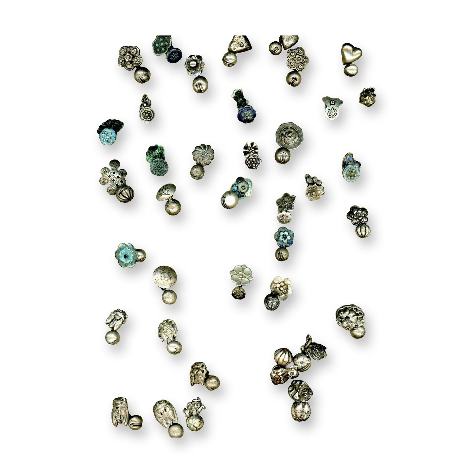 A CARD OF DIVISION ONE CHINESE METAL BUTTONS: 37 Silver Toggle button examples from the 19th century. This is a card of early Chinese silver toggle buttons of two piece construction. Some pictorials and perhaps even an enamel example may be on