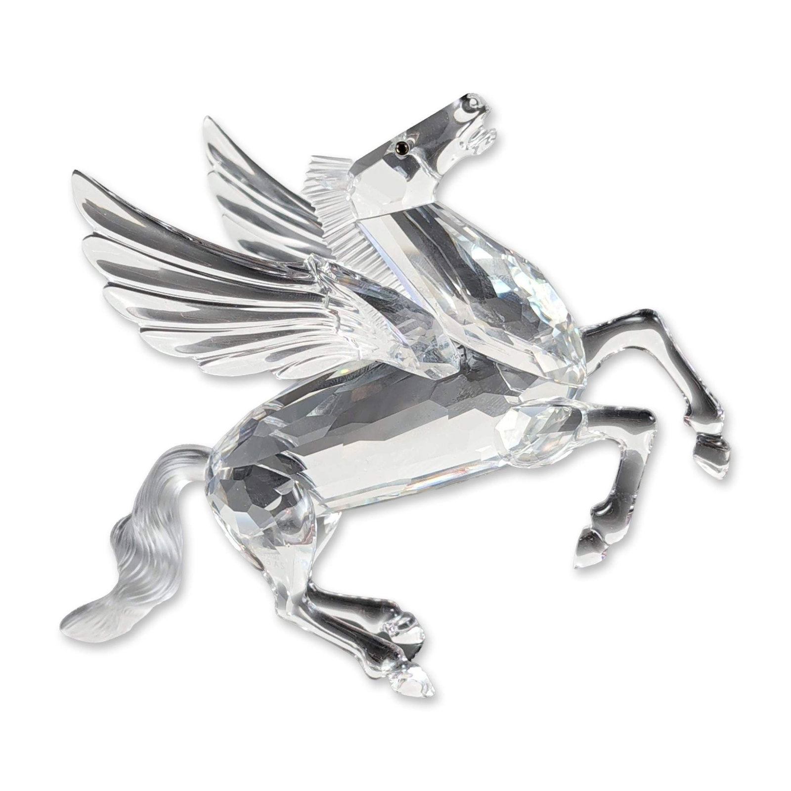 Swarovski Crystal SCS 1998 Figurine, Pegasus 216327: Faceted clear crystal figurine of the winged horse from Greek mythology, representing the final piece in the Fabulous Creatures trilogy. The design features a frosted crystal mane and tail with small 