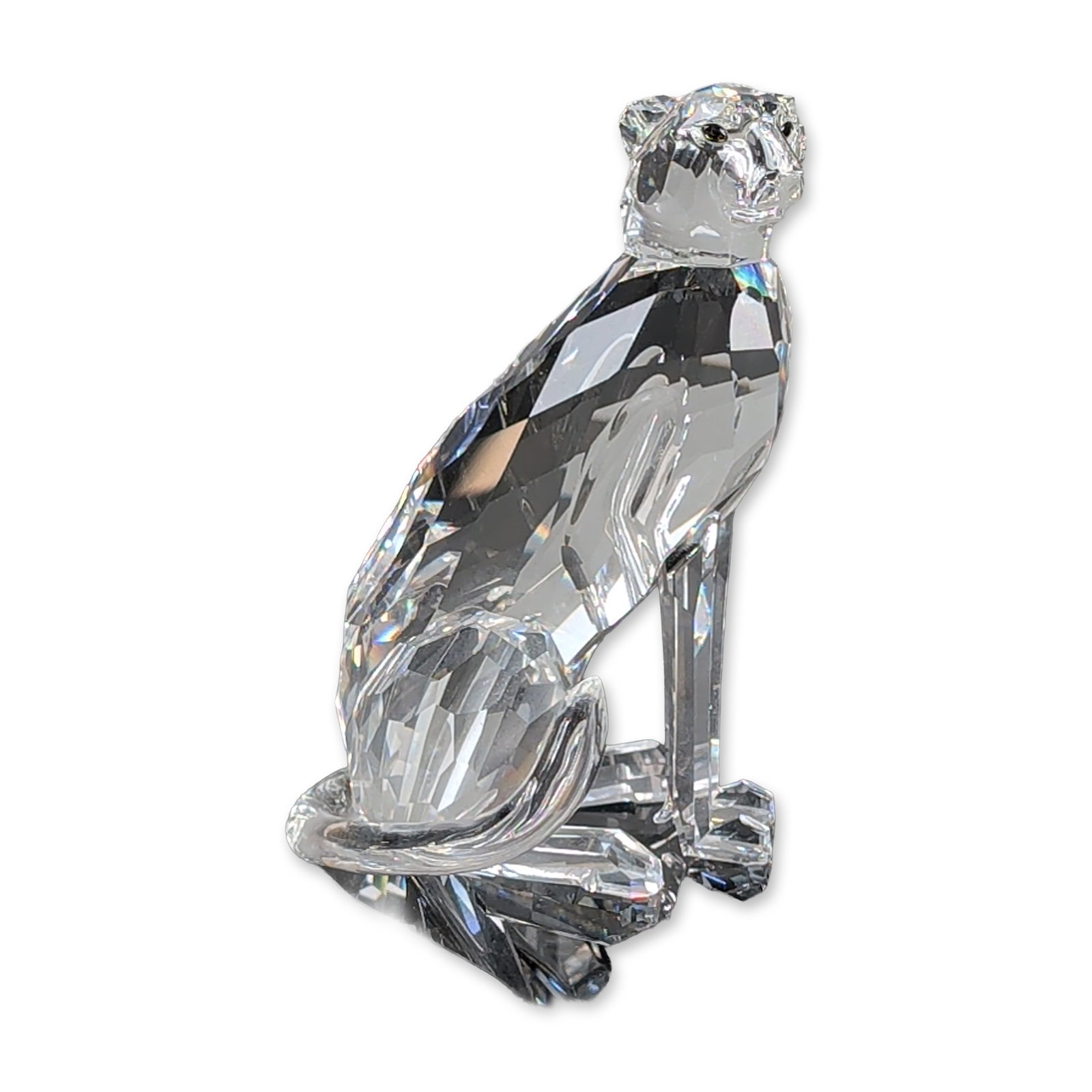 Swarovski Silver Crystal Figurine, Seated Cheetah: Swarovski Silver Crystal seated cheetah figurine from the African Wildlife collection. The piece is constructed from multi-faceted clear lead crystal with a smooth, curved crystal tail and features sm
