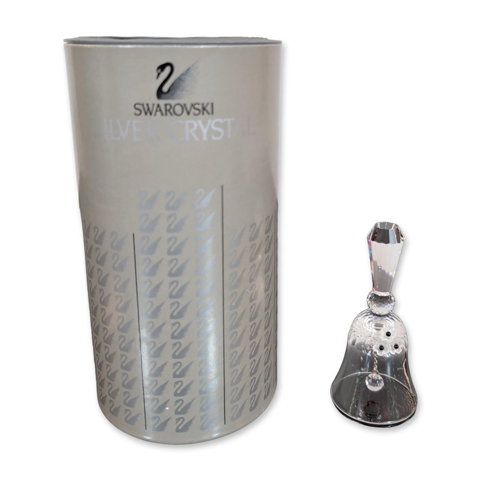Swarovski Silver Crystal Small Table Bell: The upper portion of the bell body is frosted and decorated with three stylized flower motifs, each centered with a small black crystal bead. The lower portion of the bell is clear crystal with a flar