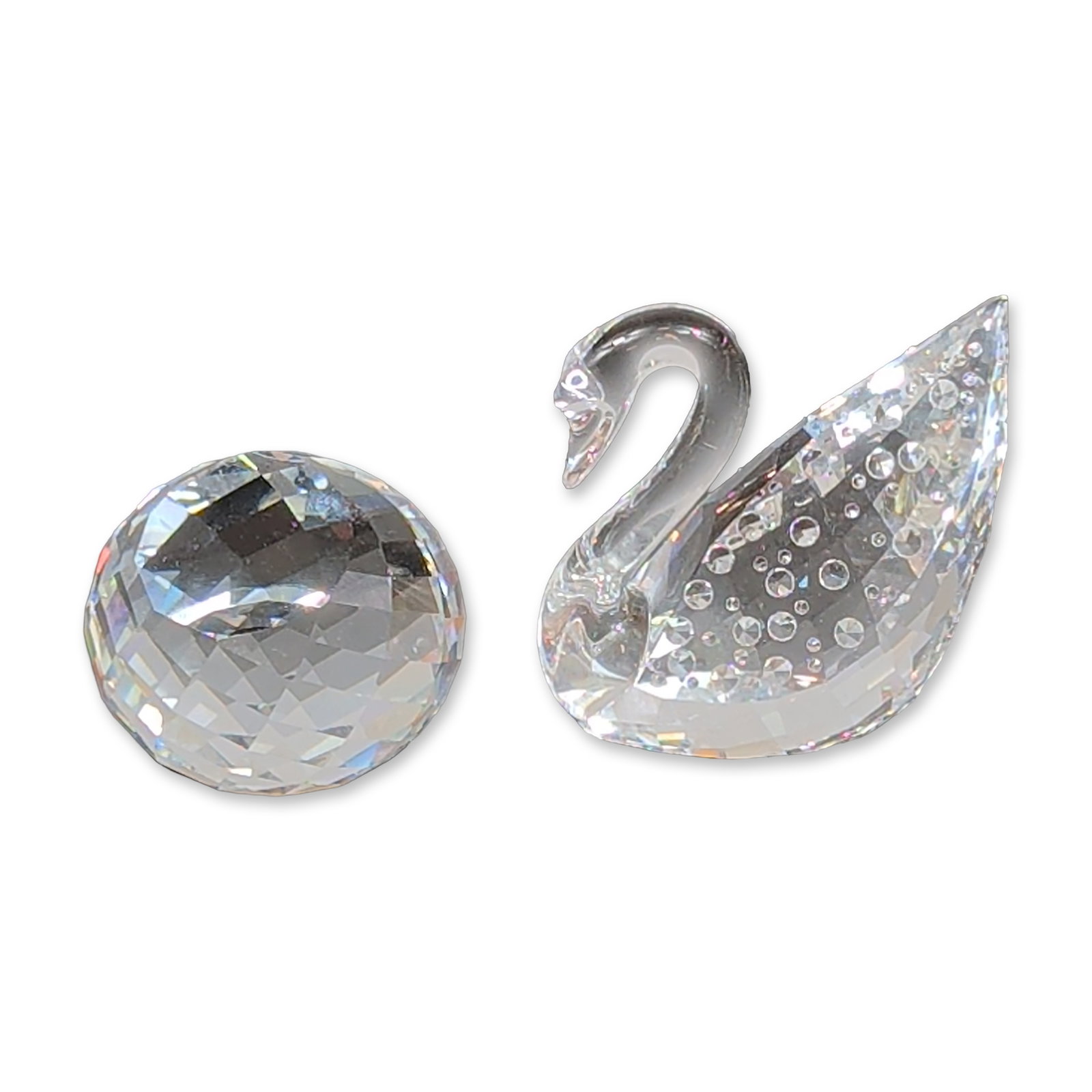 2pc Swarovski Centenary Swan Crystal Figurine Set: Swarovski Silver Crystal Centenary Swan figurine set, released in 1995 to mark the company's 100th anniversary. The set includes a lead crystal swan figurine with a faceted body and a separate faceted