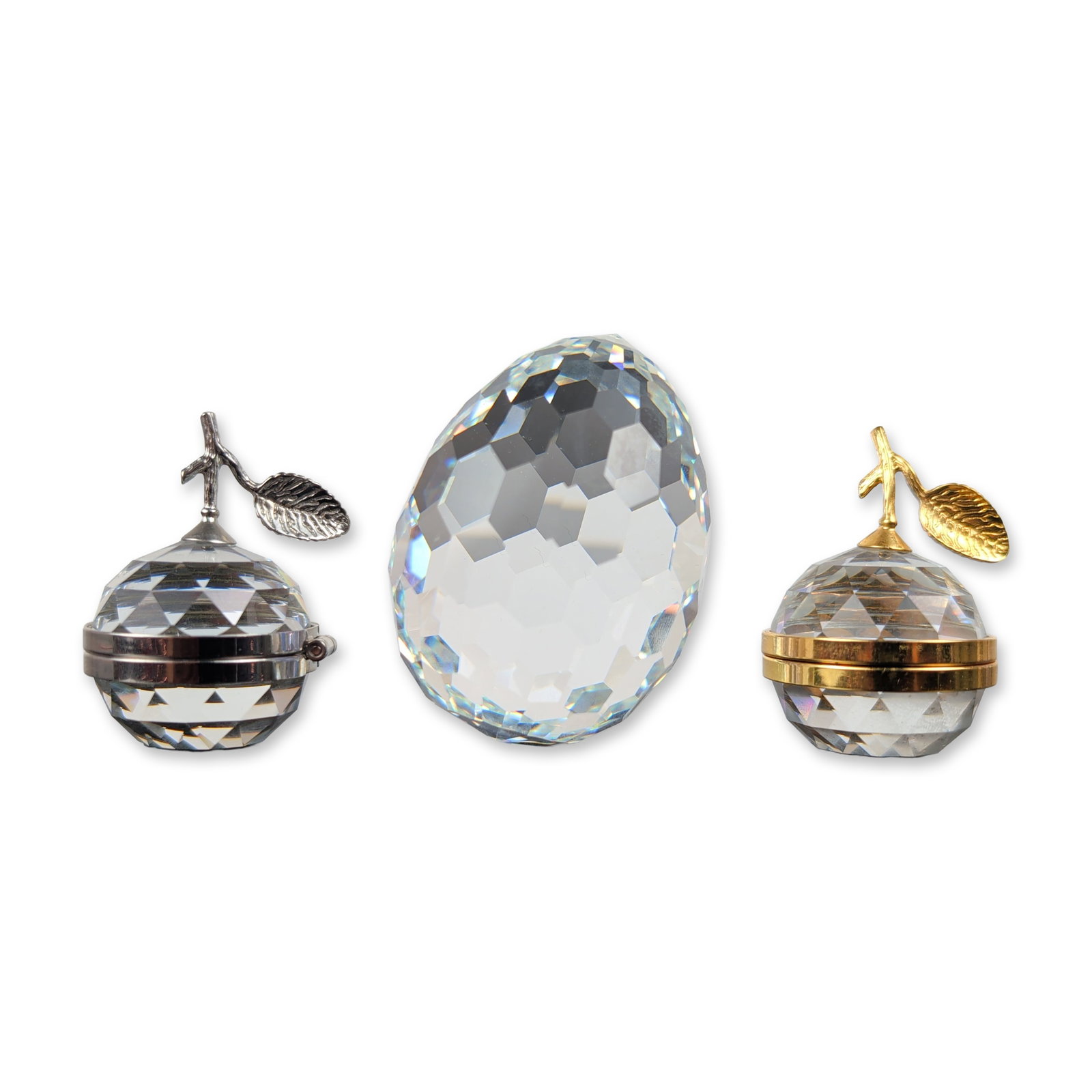 3pc Swarovski Silver Crystal Decorative Items: Swarovski faceted lead crystal decorative items from the Silver Crystal line, including one faceted crystal egg and two apple-shaped photo frames. The frames feature faceted crystal bodies with metal 