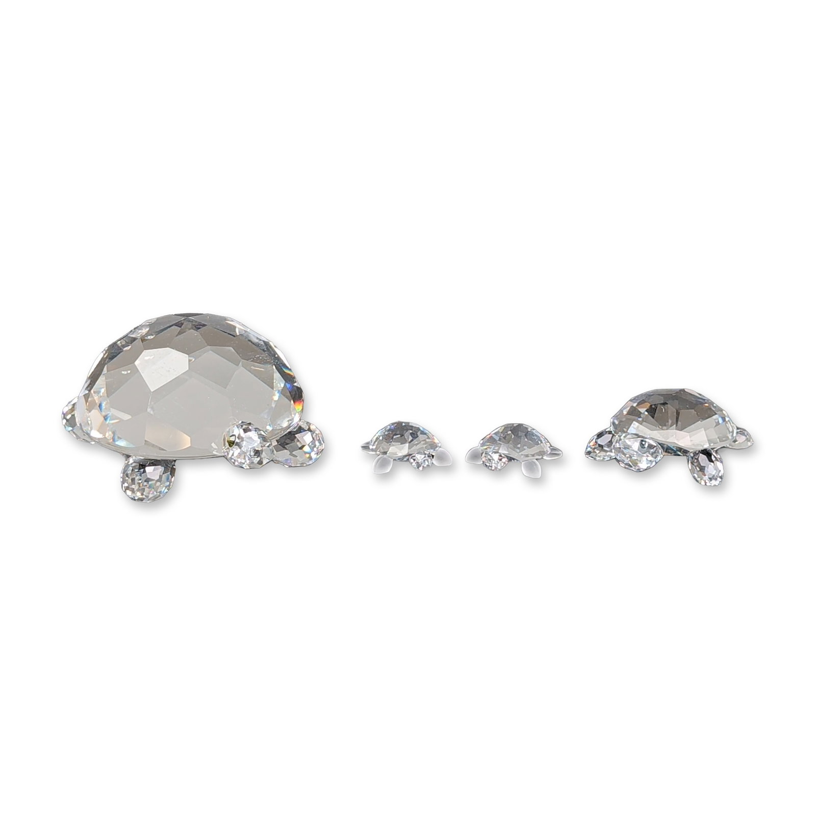4pc Swarovski Silver Crystal Turtle Figurines: Swarovski Silver Crystal. Two singles and one pair of turtle figurines in faceted clear crystal, featuring graduated sizes with smooth rounded heads and flippers. Each example is etched with the Swaro