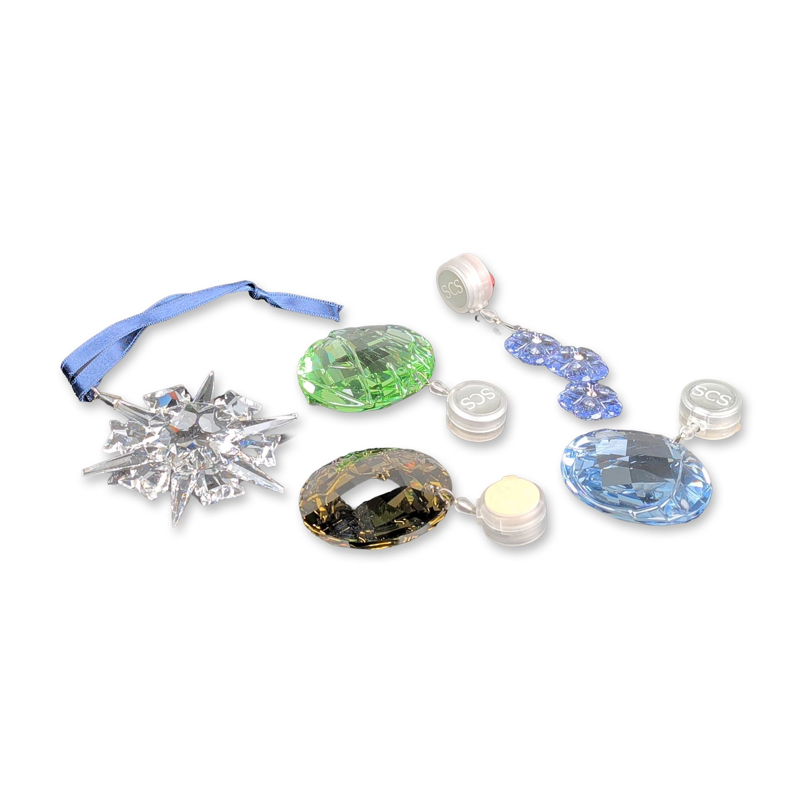 5pc Swarovski Crystal Annual Edition and SCS Ornaments: This curated collection features five faceted lead crystal ornaments from Swarovski, including the 2002 Annual Edition Christmas Star suspended from a blue textile ribbon with an embossed silver-tone 