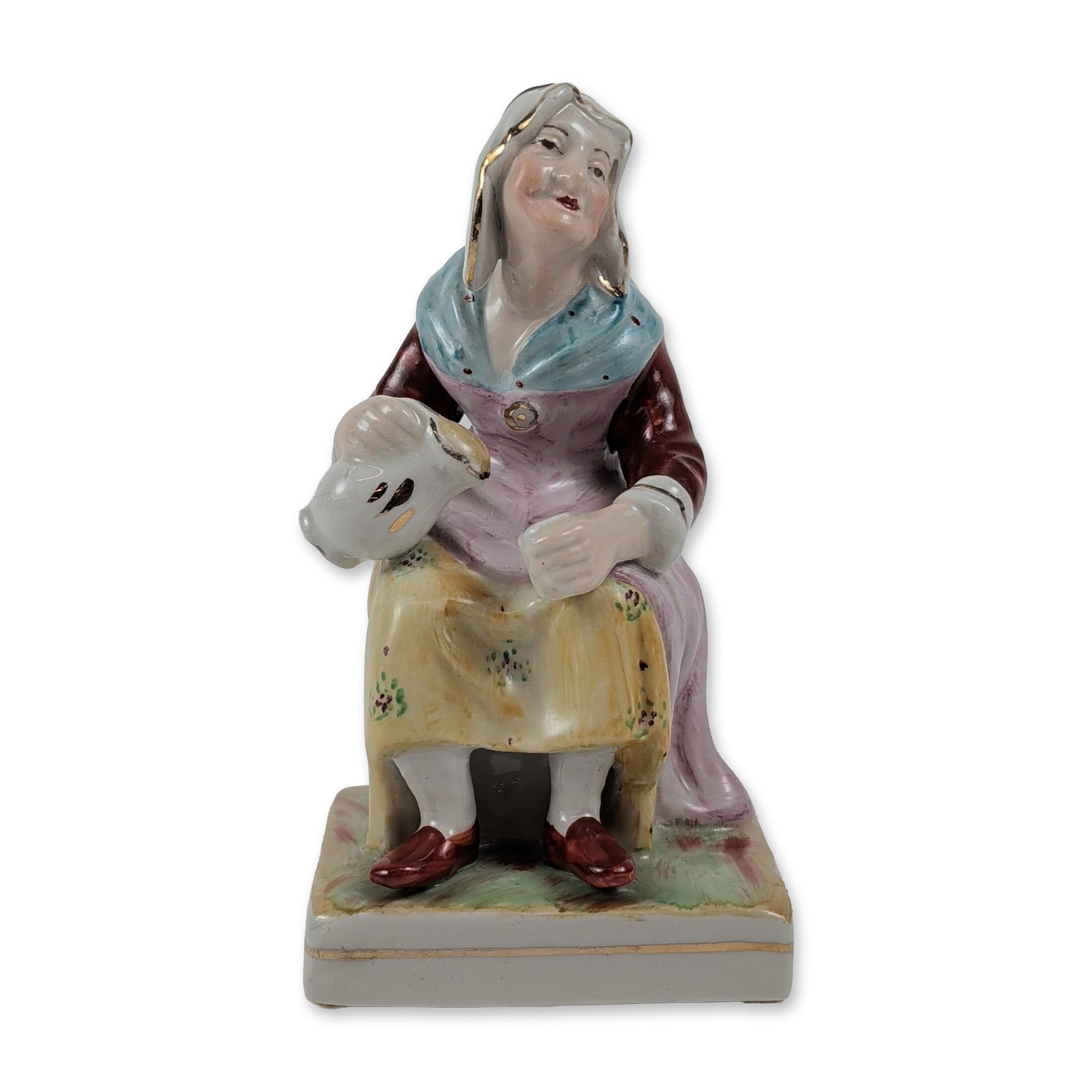 William Kent Staffordshire Pottery Nell the Cobbler's Wife Figurine: William Kent Porcelains Ltd. Hand-painted porcelain figurine depicting Nell the Cobbler's Wife. The seated figure is dressed in a dark red jacket, a blue shawl with gilded trim, and a patterned yellow