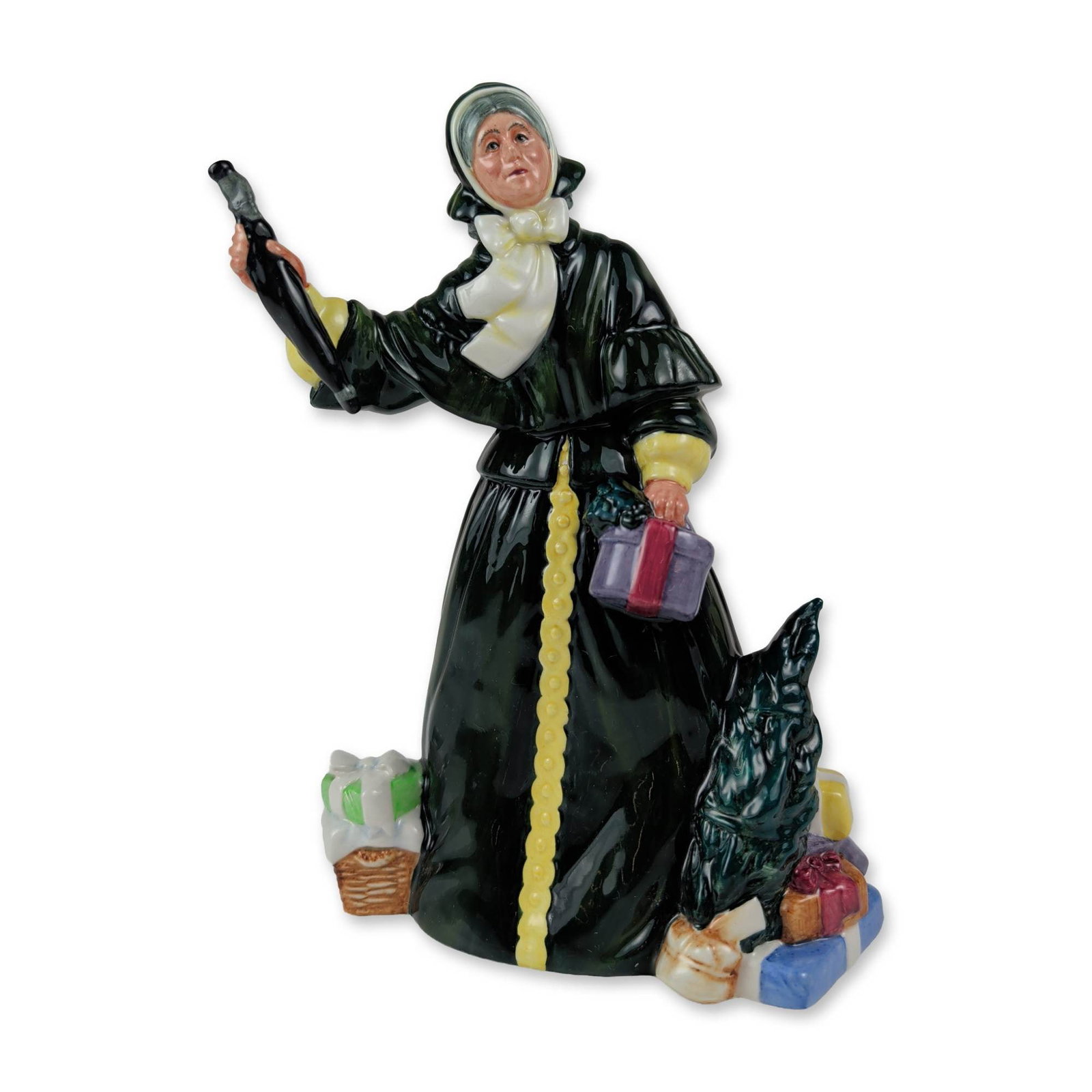 Royal Doulton Christmas Parcels Porcelain Figurine: Royal Doulton Christmas Parcels figurine, model HN 2851, in polychrome glazed fine bone china. Designed by W.K. Harper and issued in 1977. The figure depicts a woman in Victorian style winter attire, 