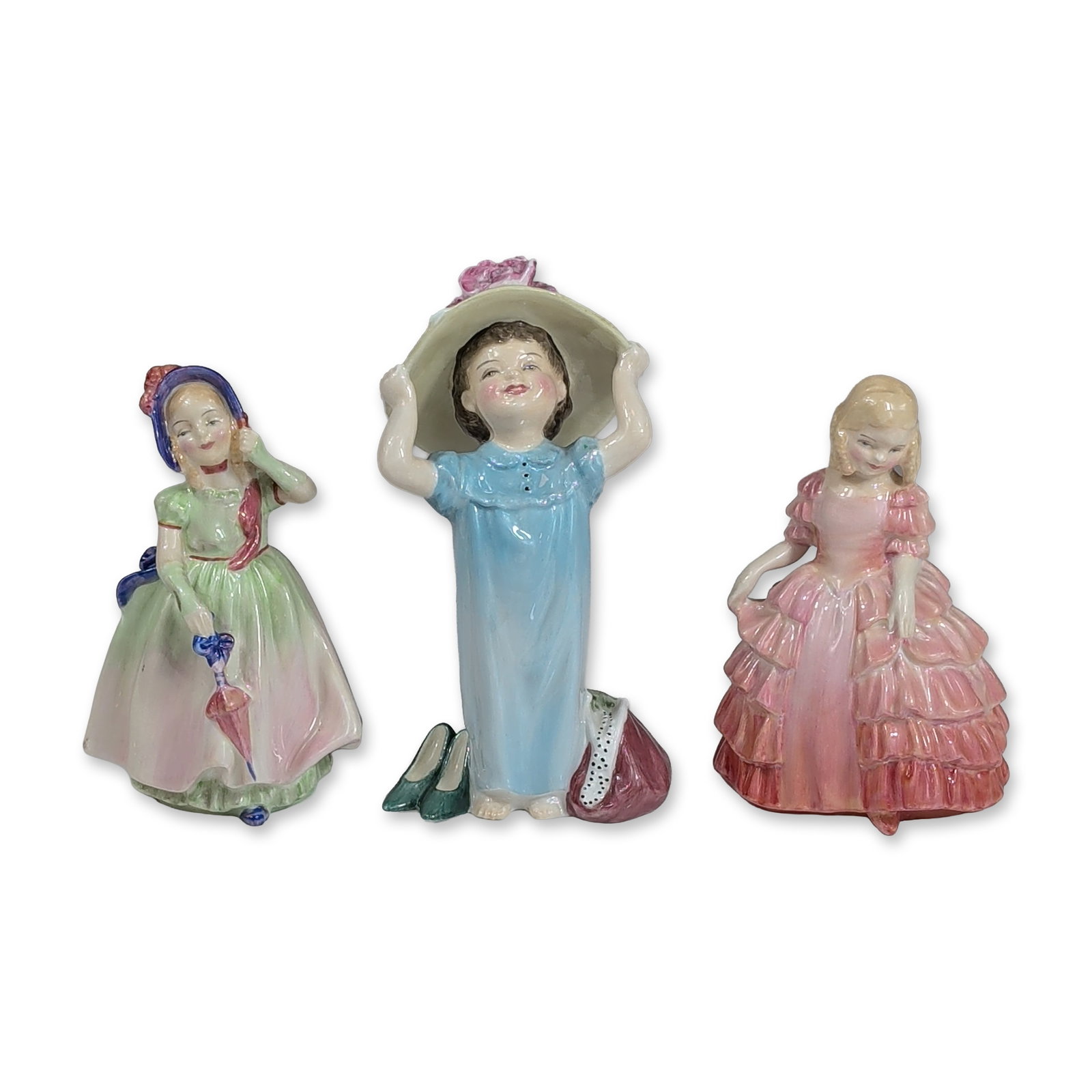 3pc Royal Doulton Porcelain Figurines: Porcelain figurines depicting young ladies on colorful dresses. Each figurine base features the green Royal Doulton factory backstamp. Dimensions of the largest item: 5.5"H. Weight: 0.91 lbs. Dimensio