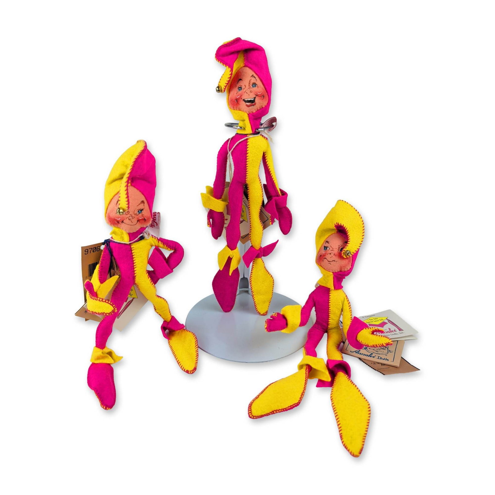3pc Annalee Summer Social Jester Dolls: Annalee Mobilitee Dolls, Inc. poseable harlequin dolls in pink and yellow felt, part of the 1997 Summer Social series. Each figure is constructed with an internal wire armature and features hand-paint