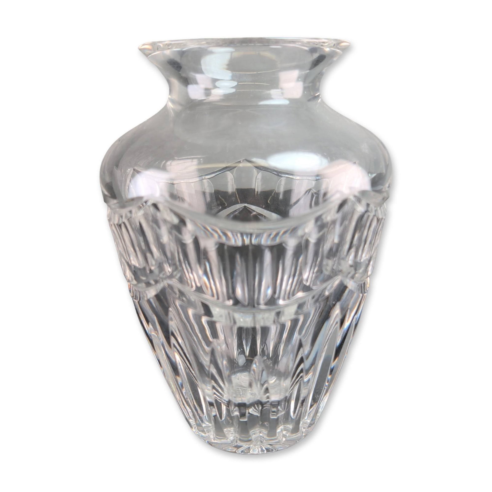 Waterford Crystal Pompeii Bud Vase: Waterford Crystal bud vase in the Pompeii pattern. Lead crystal construction featuring deep vertical miter cuts and a horizontal band of oval thumbprint facets. The circular base is decorated with a s