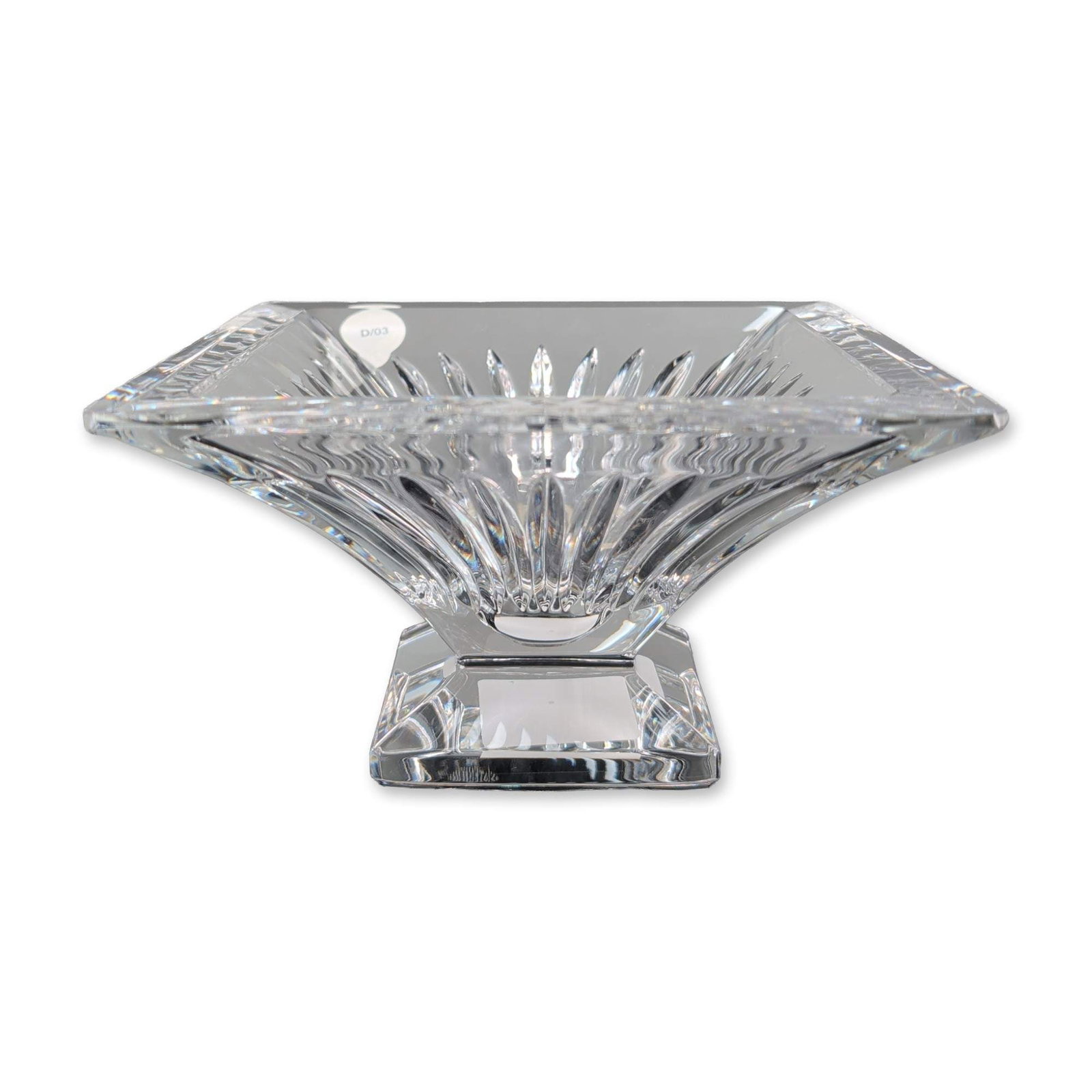 Waterford Clarion Lead Crystal Pedestal Bowl: Waterford lead crystal square pedestal bowl in the Clarion pattern. Design features deep radial wedge cuts extending from the center toward the corners. The vessel is elevated on a stepped square base