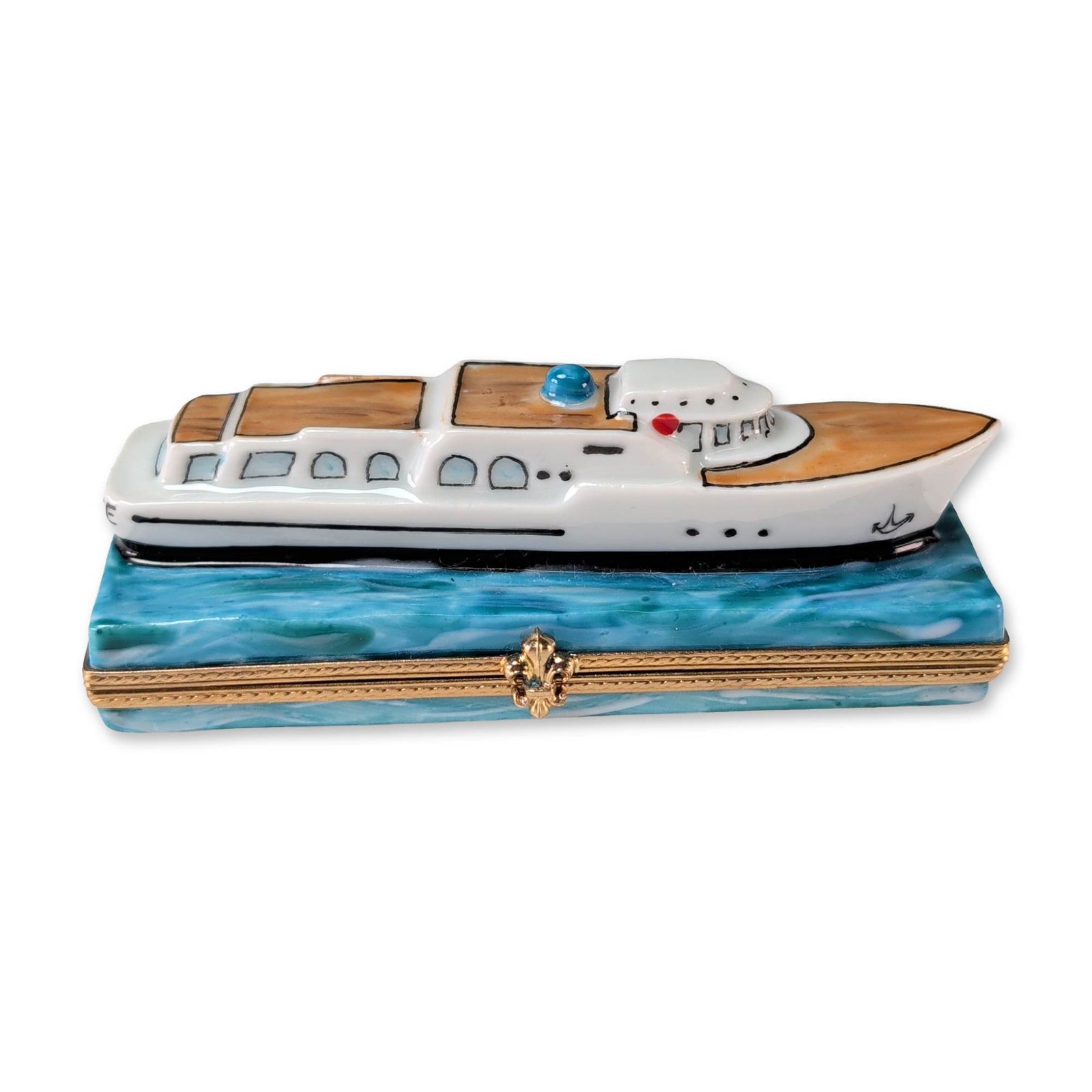 Carenton Porcelaine Limoges Yacht Trinket Box: Carenton Porcelaine Limoges hand painted porcelain trinket box modeled as the luxury yacht Excellence. The vessel is set upon a rectangular base with a blue marbled glaze simulating water. The exterio