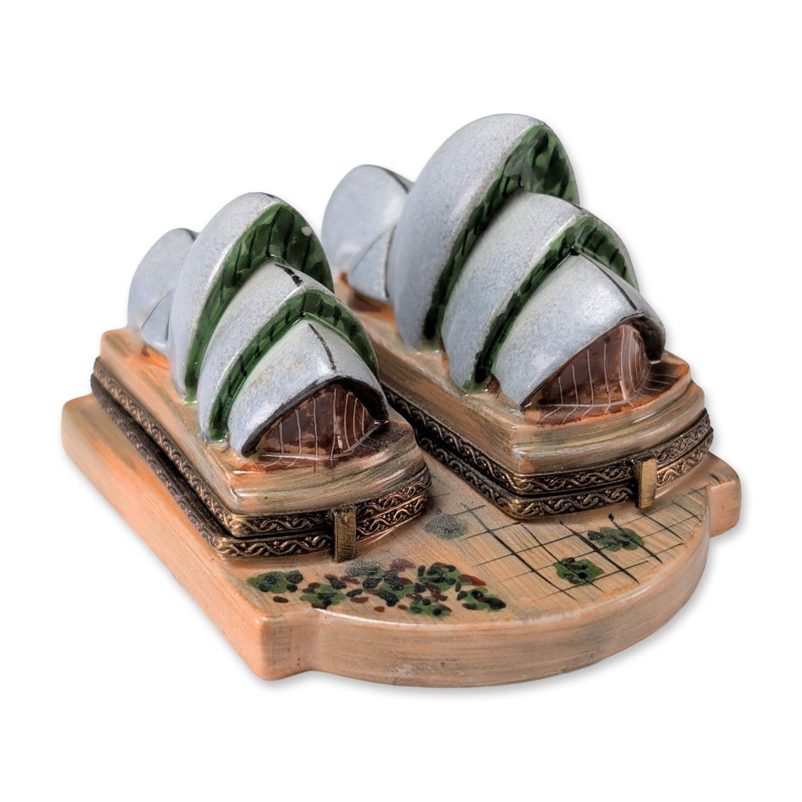 Elda Creation Limoges Sydney Opera House Box: Elda Creation Limoges porcelain trinket box modeled as the Sydney Opera House. This double-lidded piece features a hand-painted exterior in light gray with green and brown accents. The interior is div
