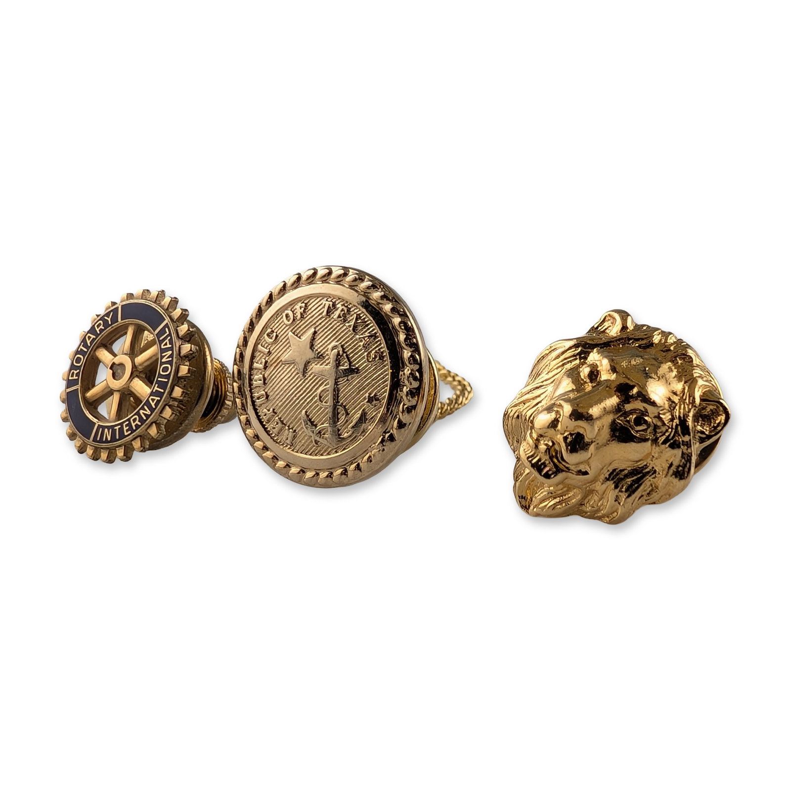 3pc Vintage Gold-Tone Pins and Tie Pin Accessories: Trio of vintage gold-tone men's accessories. Includes one Rotary International gear wheel lapel pin with blue enamel lettering, marked 10K-G.F. on the reverse. One Republic of Texas tie tac featuring 