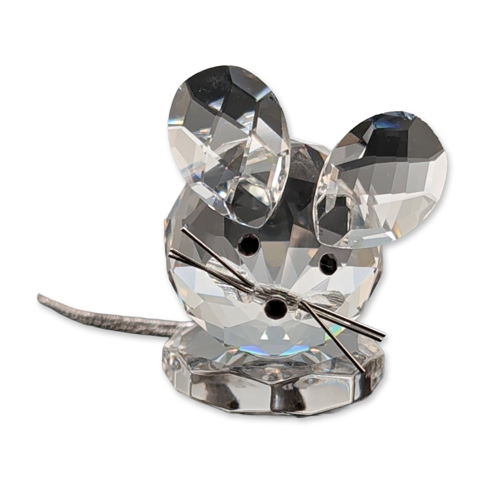 Swarovski Crystal Replica Mouse Figurine: Swarovski Silver Crystal collection mouse figurine crafted from faceted clear lead crystal. The figure features a spherical faceted body and head, and two flat teardrop-shaped ears. Accented with two 