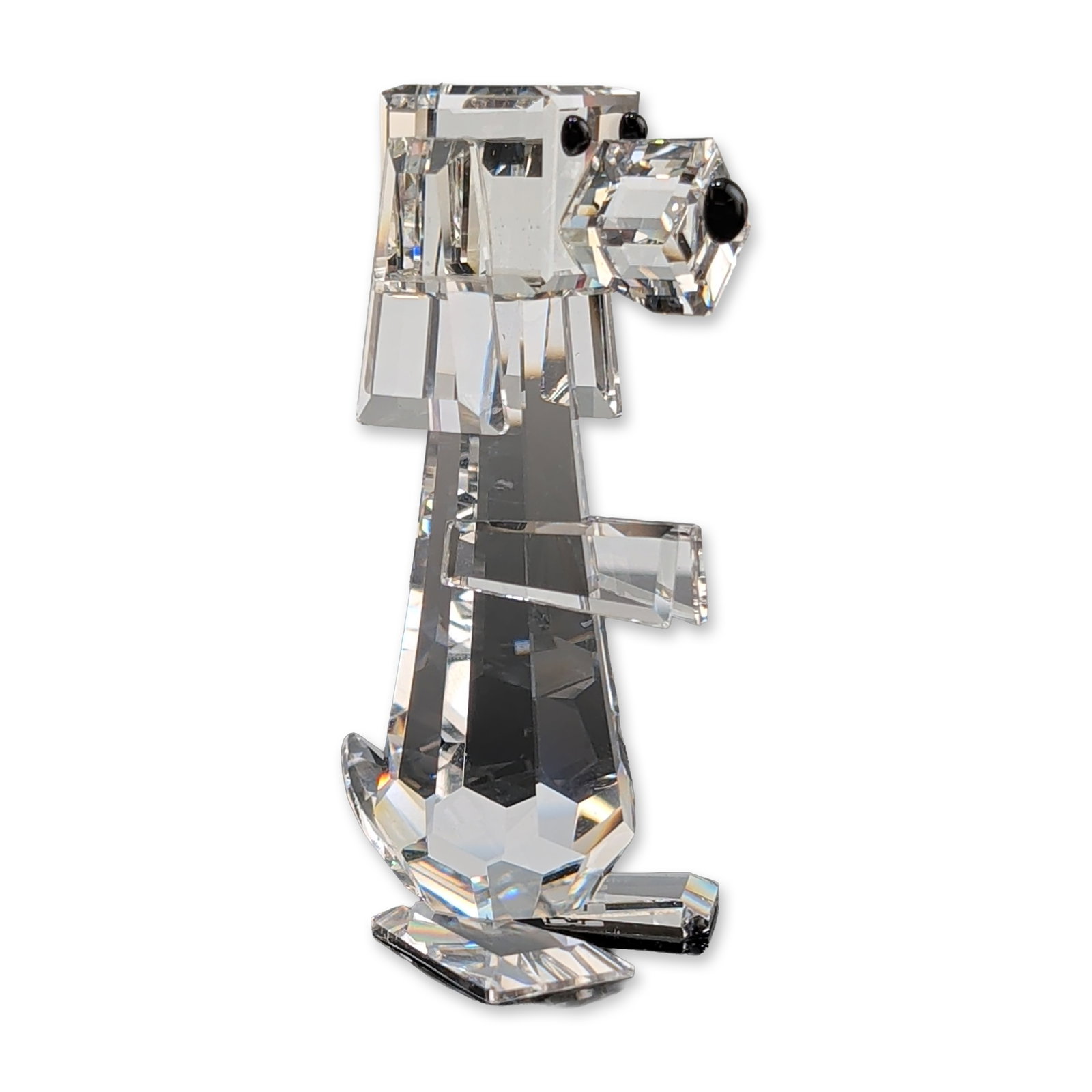 Swarovski Silver Crystal Tall Pluto Dog Figurine: Swarovski Silver Crystal Tall Pluto dog figurine in faceted clear lead crystal, featuring three small black crystal accents representing the eyes and nose. The piece is marked with the etched Swarovsk