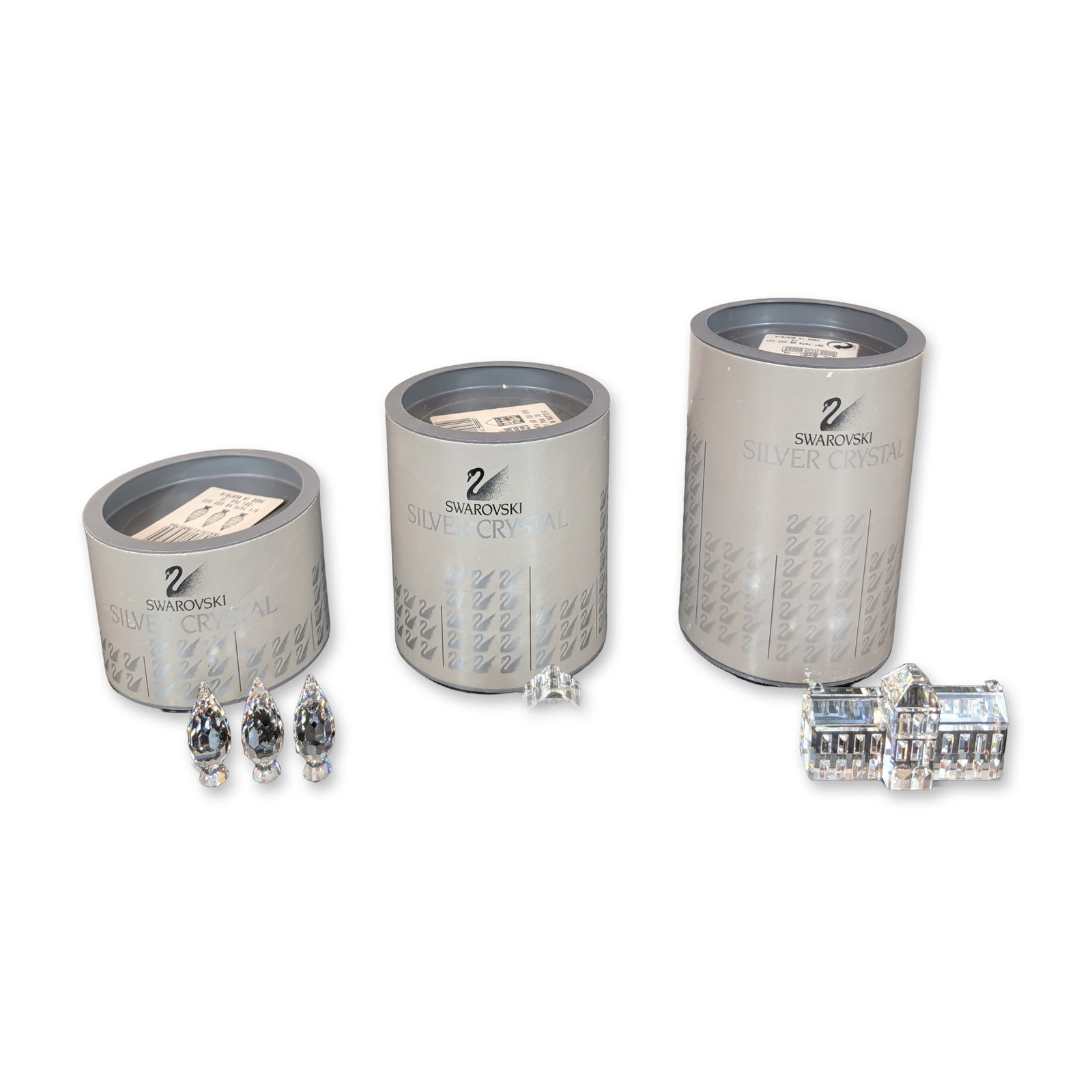 3pc Swarovski Silver Crystal Architectural Figurine Collection: Three Swarovski Architectural group in faceted lead crystal from the Silver Crystal line, designed by Gabrielle Stamey. The group features a large multi-component manor house, gabled houses with etche