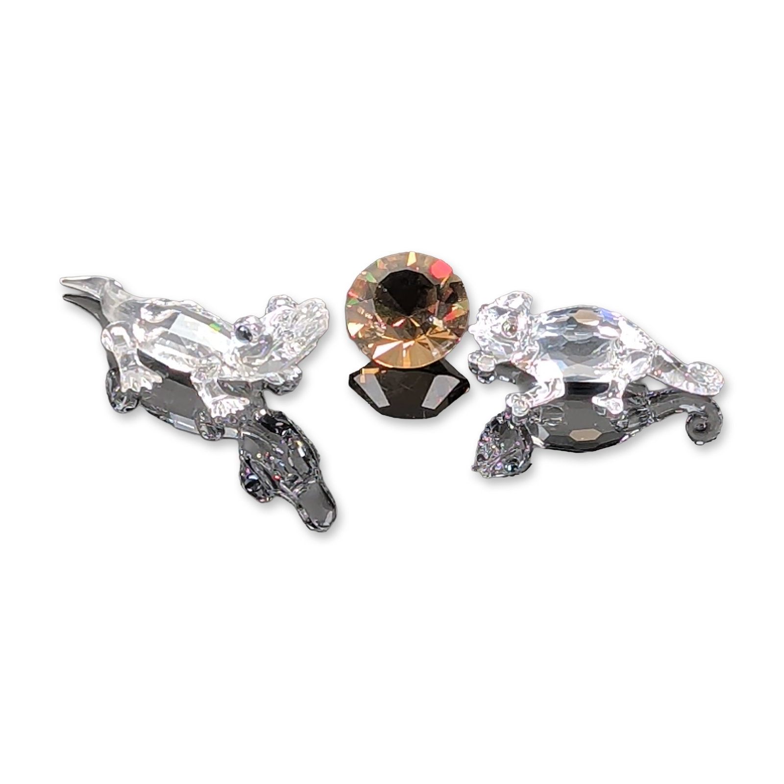 3pc Swarovski Silver Animal Figurines, Chameleon and Alligator: The crystal items featuring a mini alligator figurine and a chameleon figurine with his chaton cut crystal. The animal figurines are designed with clear faceted bodies, frosted crystal feet, and black