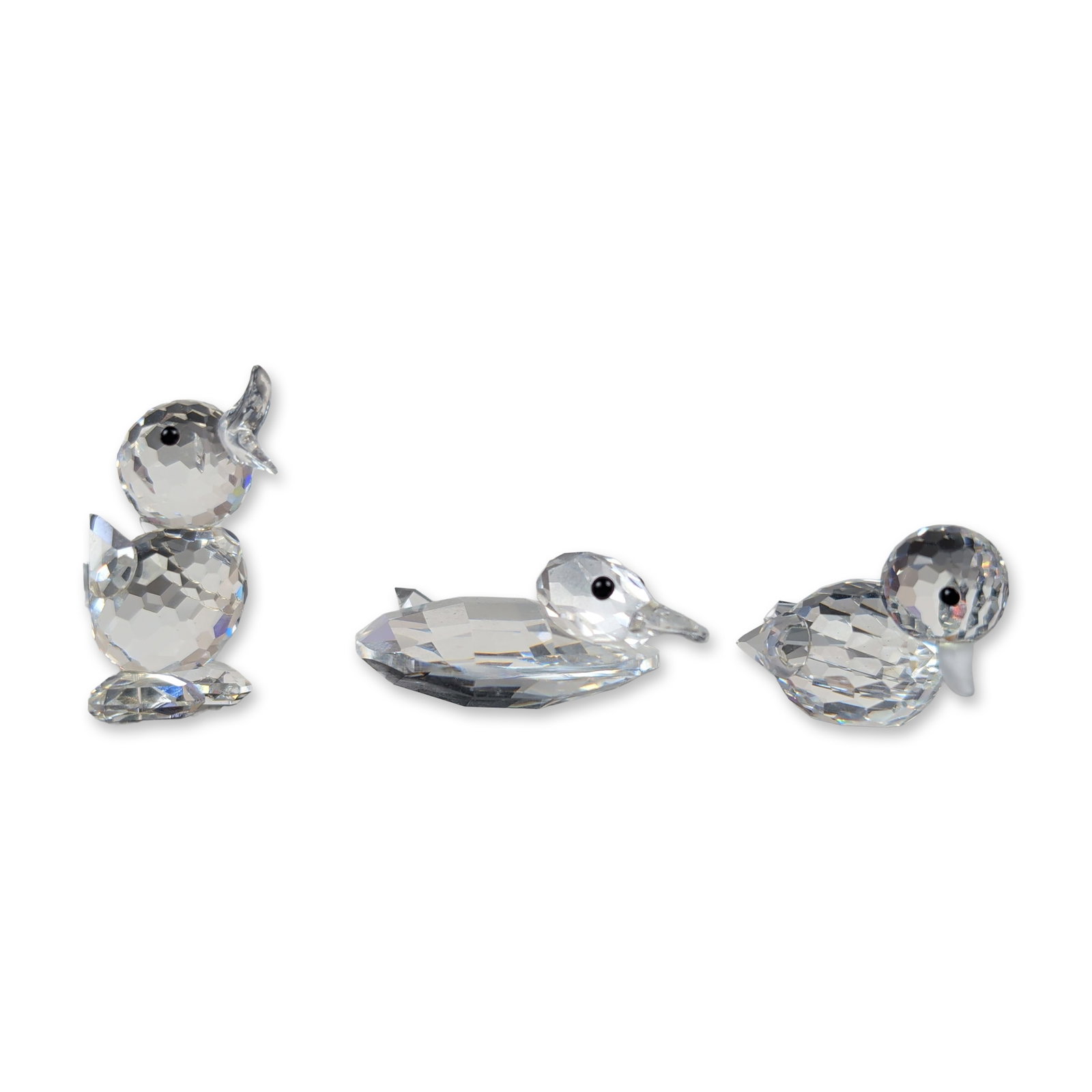 3pc Swarovski Silver Crystal Duck Figurines: Three figurines in faceted lead crystal, featuring a swimming duck, a quacking duck chick, and a medium duck. Each figure is constructed with faceted bodies and applied black bead eyes. The lot includ