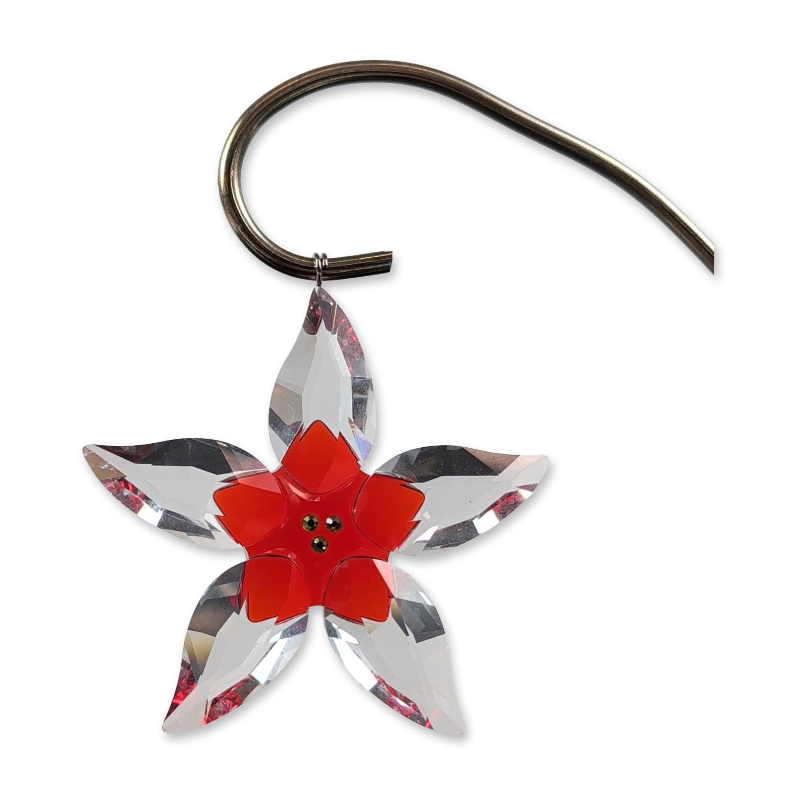Swarovski Crystal Poinsettia Flower Ornament: Swarovski faceted lead crystal poinsettia ornament, featuring layered clear and red crystal petals. The flower center is accented with three amber-toned crystal chatons. Includes a metal hanging loop 