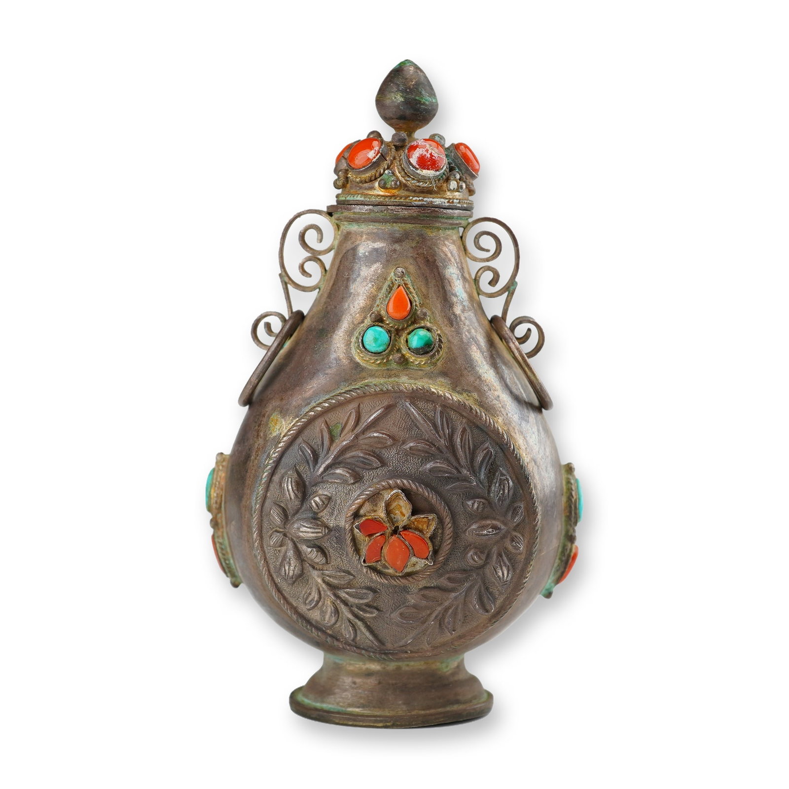 Mongolian Silver Repousse Snuff Bottle, Flowers and Leaves: Adorned with coral and turquoise stones, this Mongolian silver repousse snuff bottle with stopper features round panels showcasing flowers surrounded by leaves, accented by scroll-form handles. Dimens