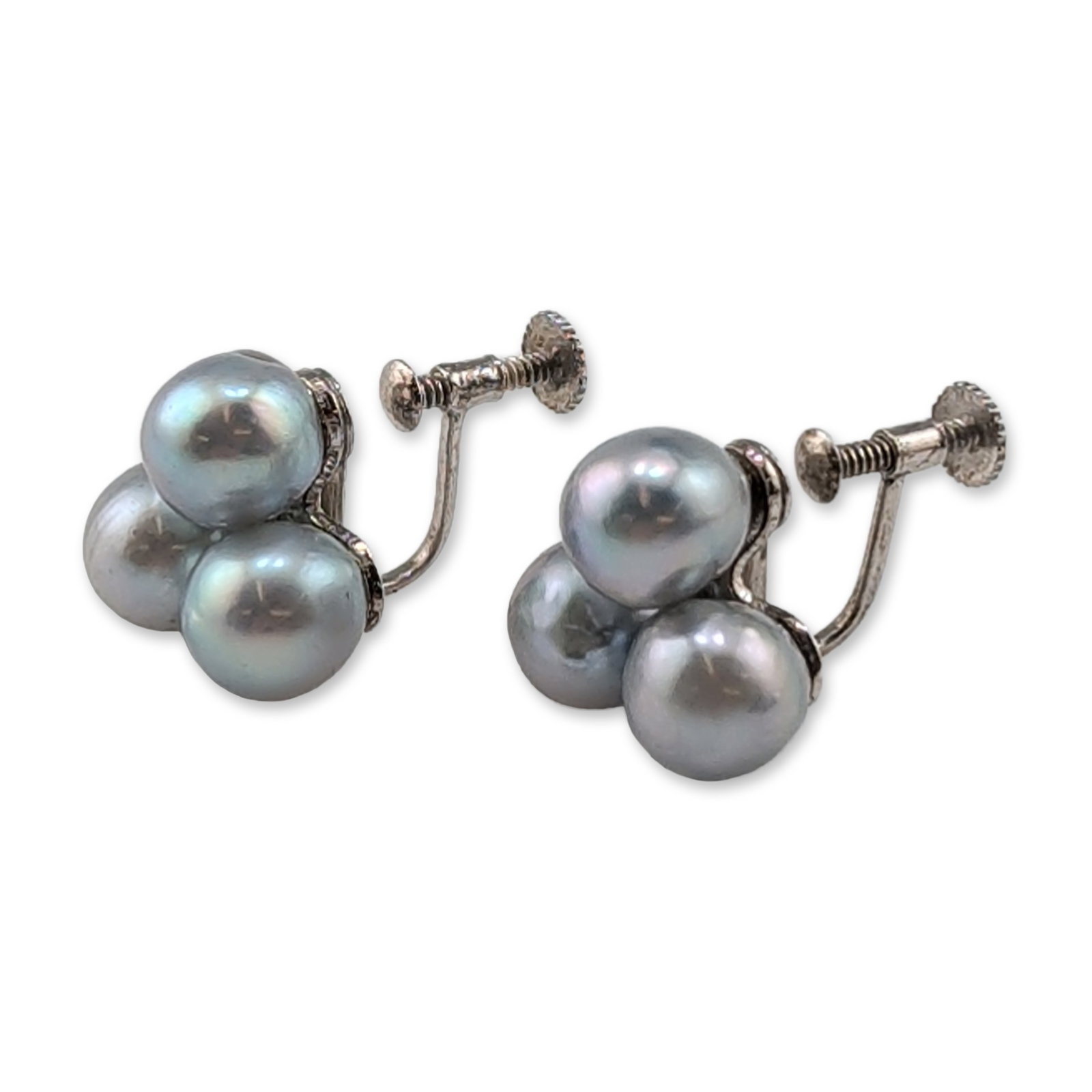 Pair of Silver Gray Pearl Screw-Back Earrings: Vintage. Pair of screw-back earrings in silver, each featuring a trefoil cluster of three gray pearls with blue-gray orient and iridescent overtones. Mounted on adjustable screw-back findings. Marked