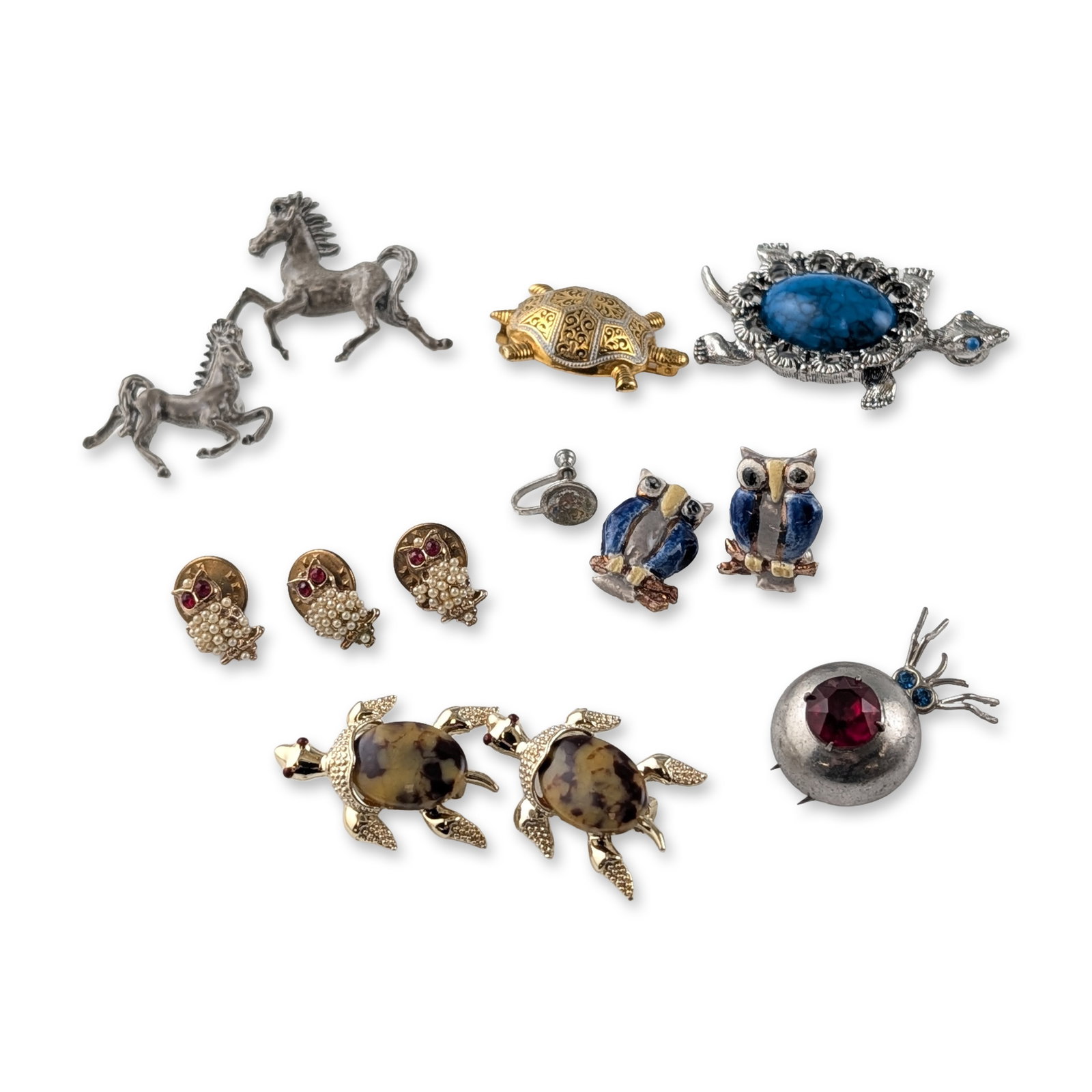12pc Vintage Animal Motif Costume Jewelry Earrings, Brooches and Pins: Vintage animal motif costume jewelry collection featuring pieces by Gerrys and Swank. The assortment includes a silver-tone turtle brooch with a blue mottled cabochon and rhinestone eyes, marked Gerry