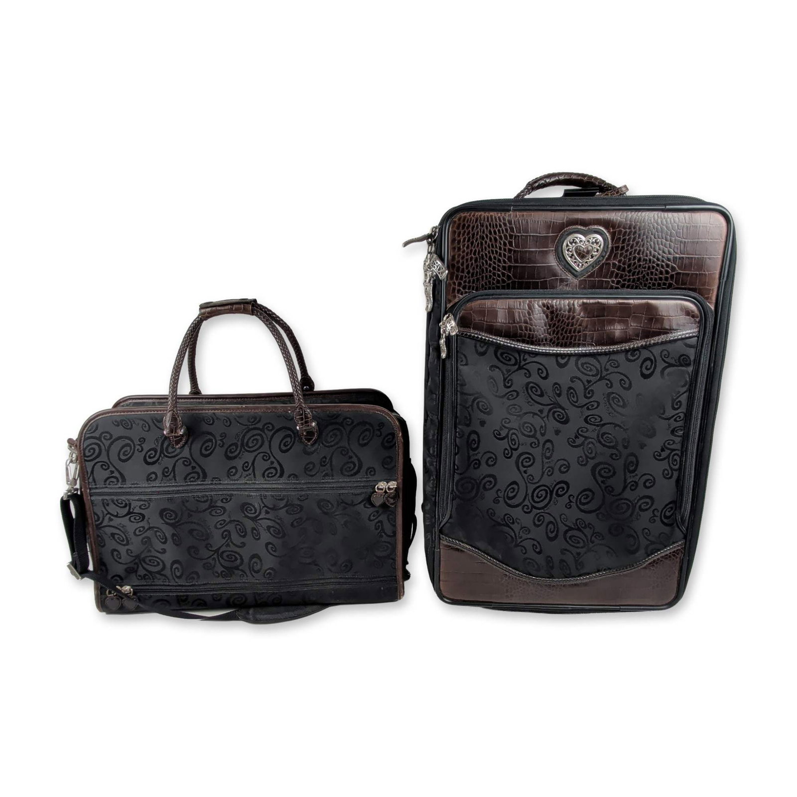 Brighton Two-Piece Scroll Pattern Luggage Set: Brighton two-piece luggage set consisting of a wheeled carry-on suitcase and a matching overnight tote bag. Exterior is constructed from black textile featuring a tonal embossed scroll motif and choco