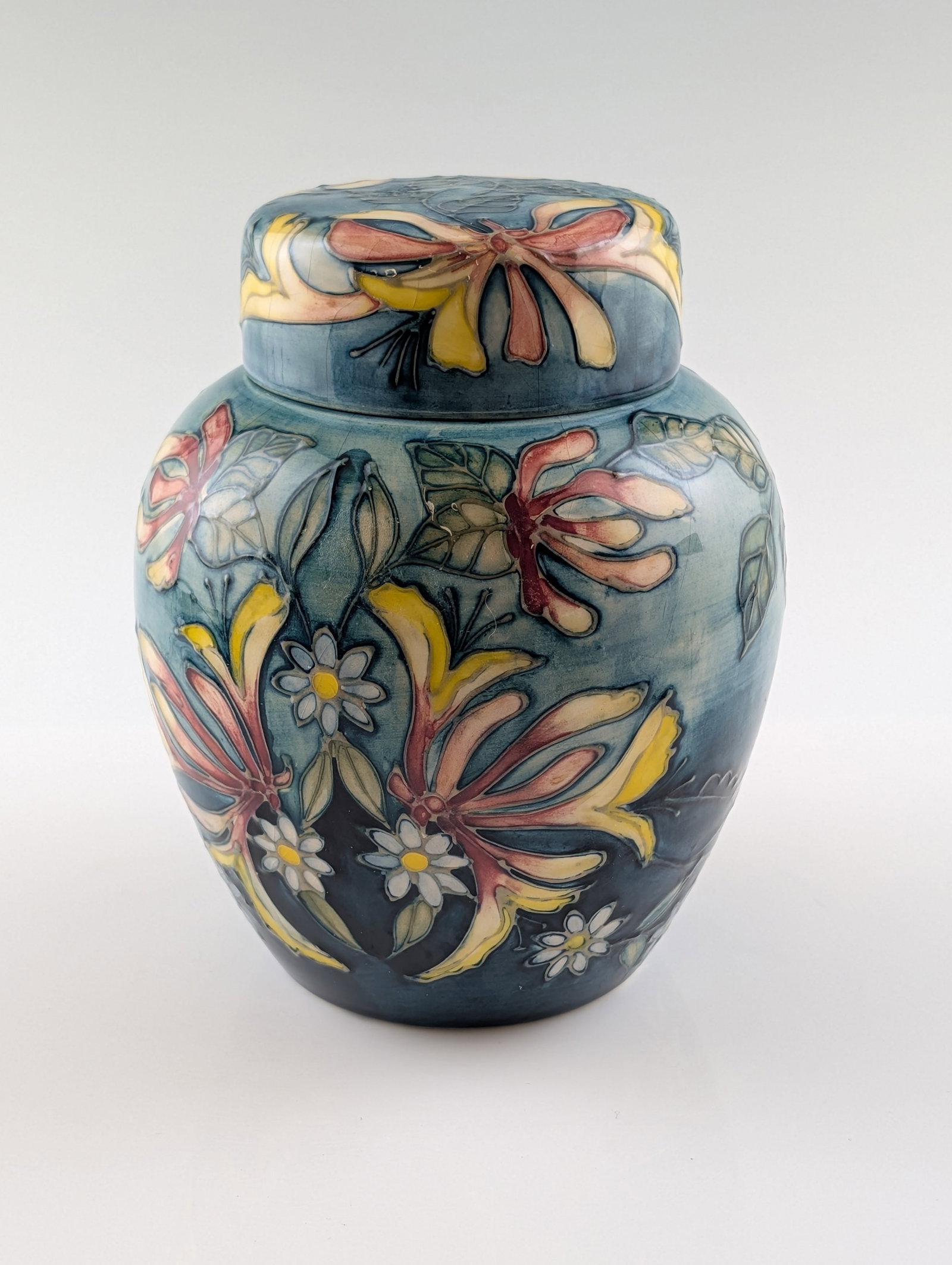 Moorcroft Midsummer Nights Dream Limited Edition Ceramic Vase: Moorcroft. Earthenware vase in the Midsummer Nights Dream pattern, designed by Rachel Bishop, featuring a bulbous form decorated with tubelined and hand-painted lilies and daisies in shades of yellow,