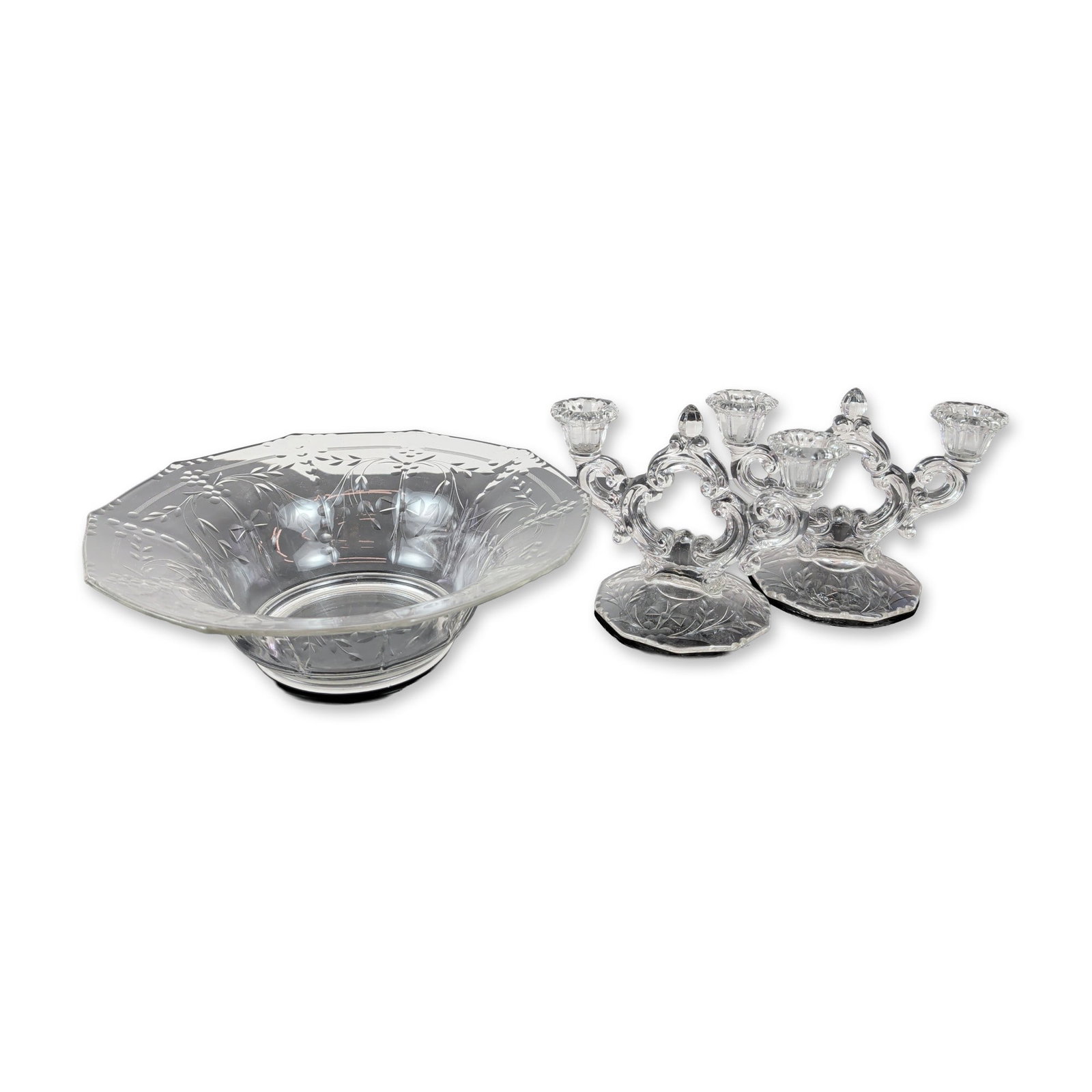 Three-Piece American Etched Glass Candelabra and Centerpiece Bowl: This mid-20th century American Elegant Glass set, marked by the Cambridge Glass Company on the base, features three clear cut glass pieces with wheel-cut and etched designs of floral sprays and eight-