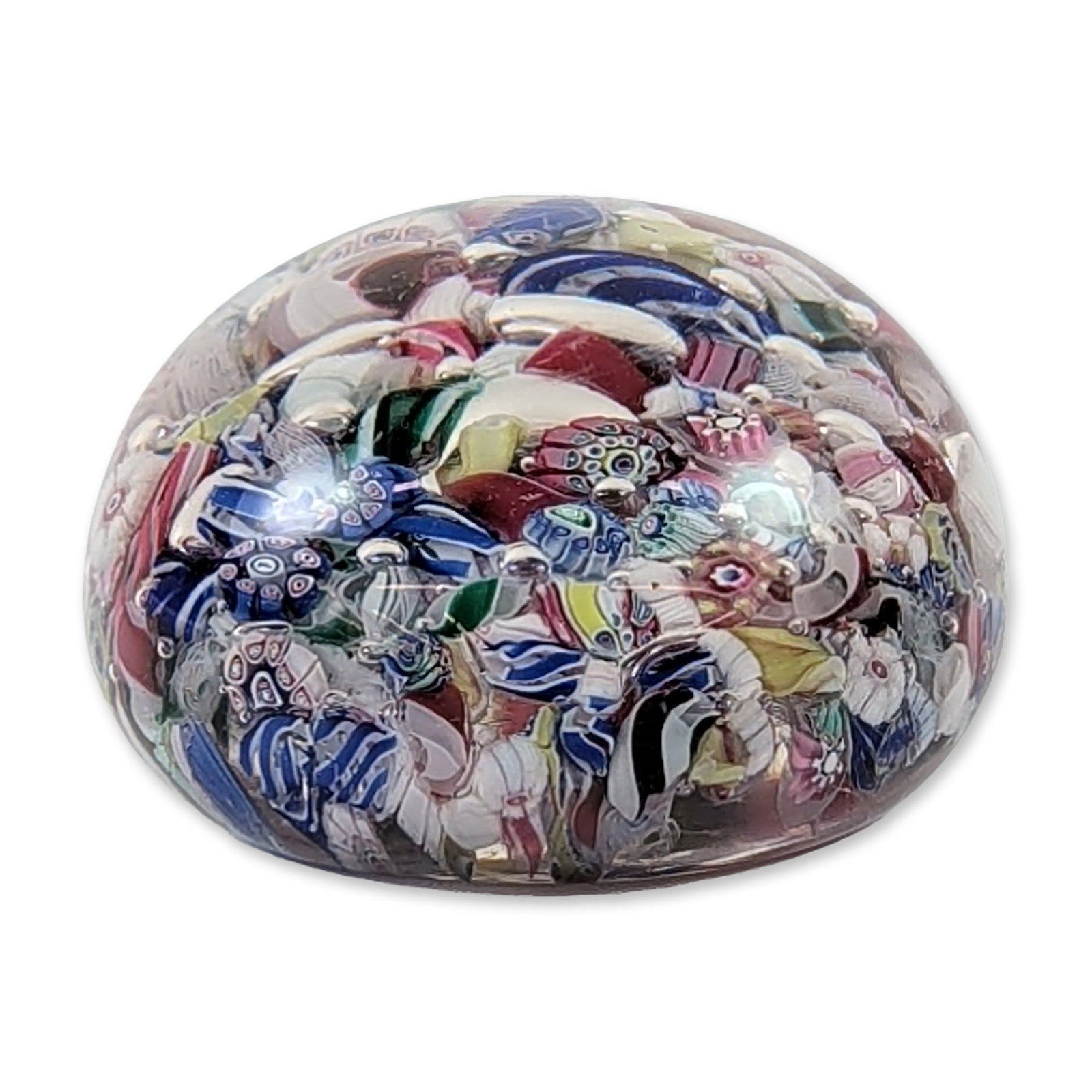 NEGC Boston & Sandwich Glass Scrambled Millefiori Glass Paperweight: Glass paperweight in a scrambled millefiori design created circa 1860. The piece features a domed clear glass body containing a densely packed arrangement of multicolored canes, including complex rose