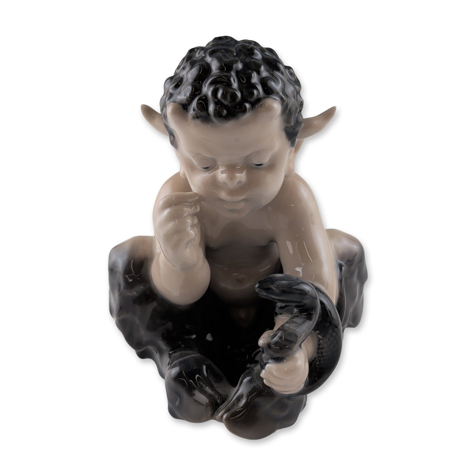 Royal Copenhagen Porcelain Faun with Snake Figurine: Royal Copenhagen glazed porcelain figurine, model number 1712, designed by Christian Thomsen. The piece depicts an infant faun or satyr seated while wrestling with a snake. Executed in the traditional
